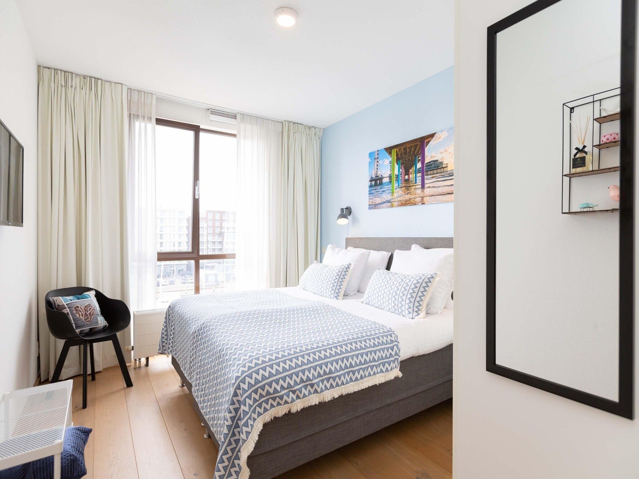 Een slaapkamer van Scheveningen Harbour 28C in Den Haag