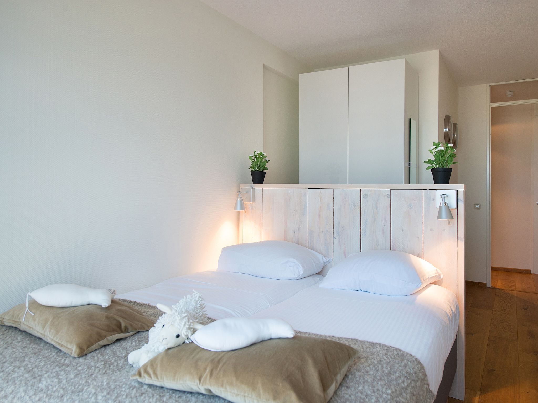Een slaapkamer van Scheveningen Harbour 32C in Den Haag