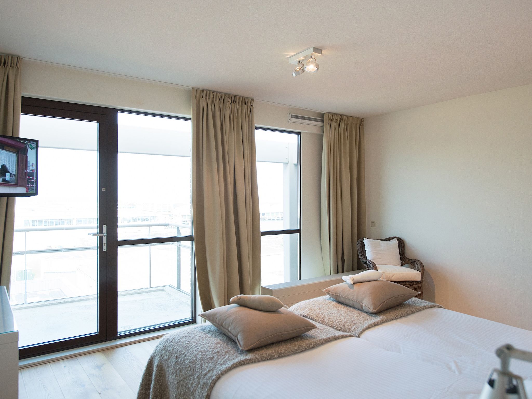 Een slaapkamer van Scheveningen Harbour 32C in Den Haag