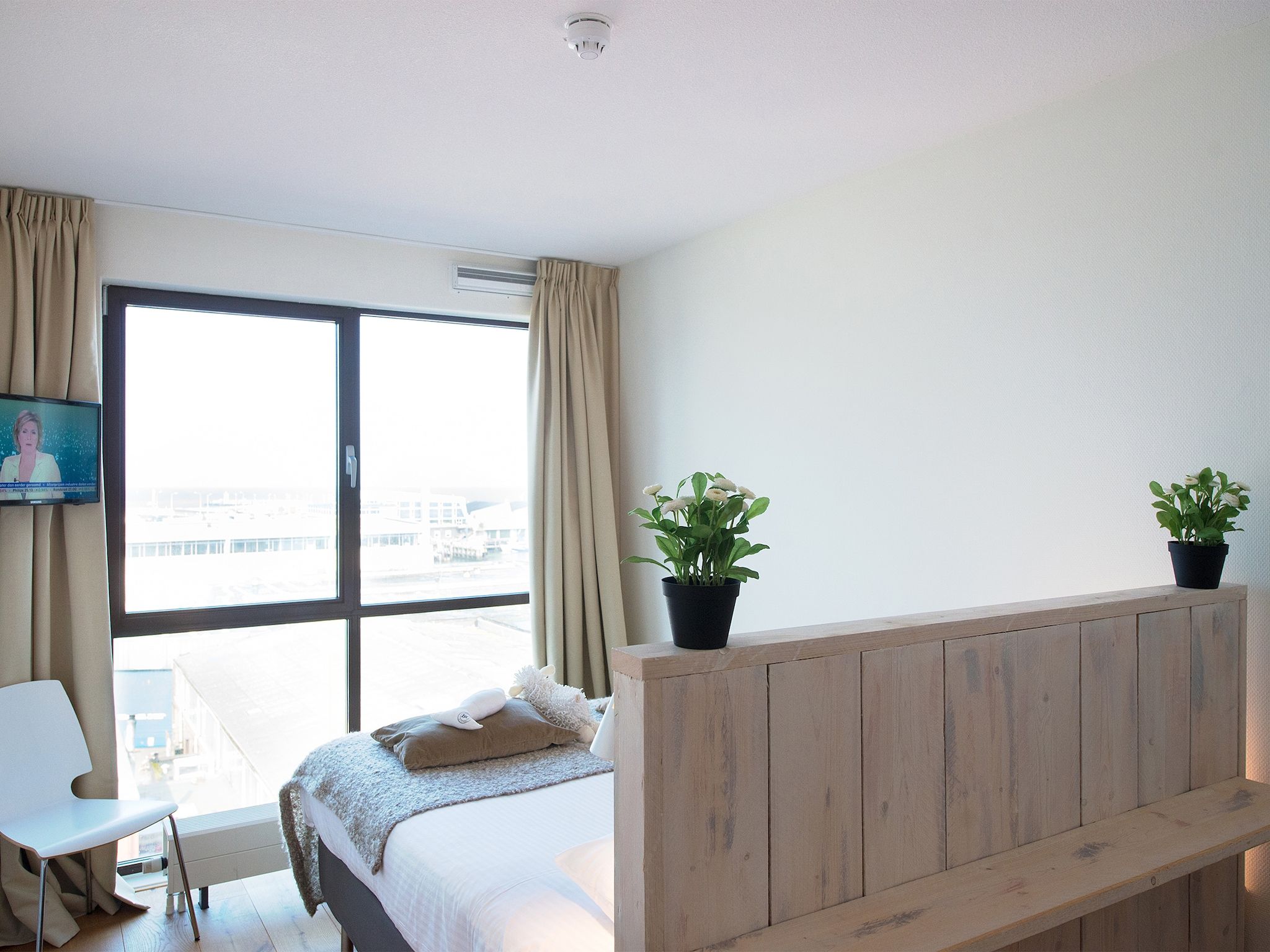 Een slaapkamer van Scheveningen Harbour 32C in Den Haag