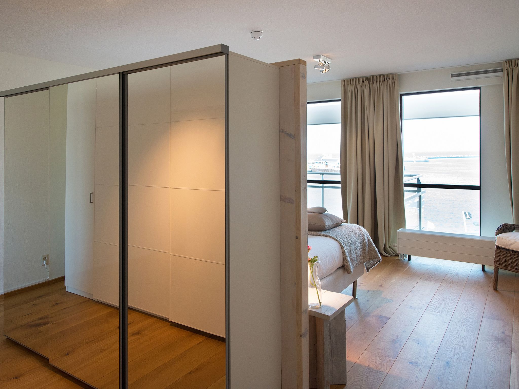 Een slaapkamer van Scheveningen Harbour 32C in Den Haag