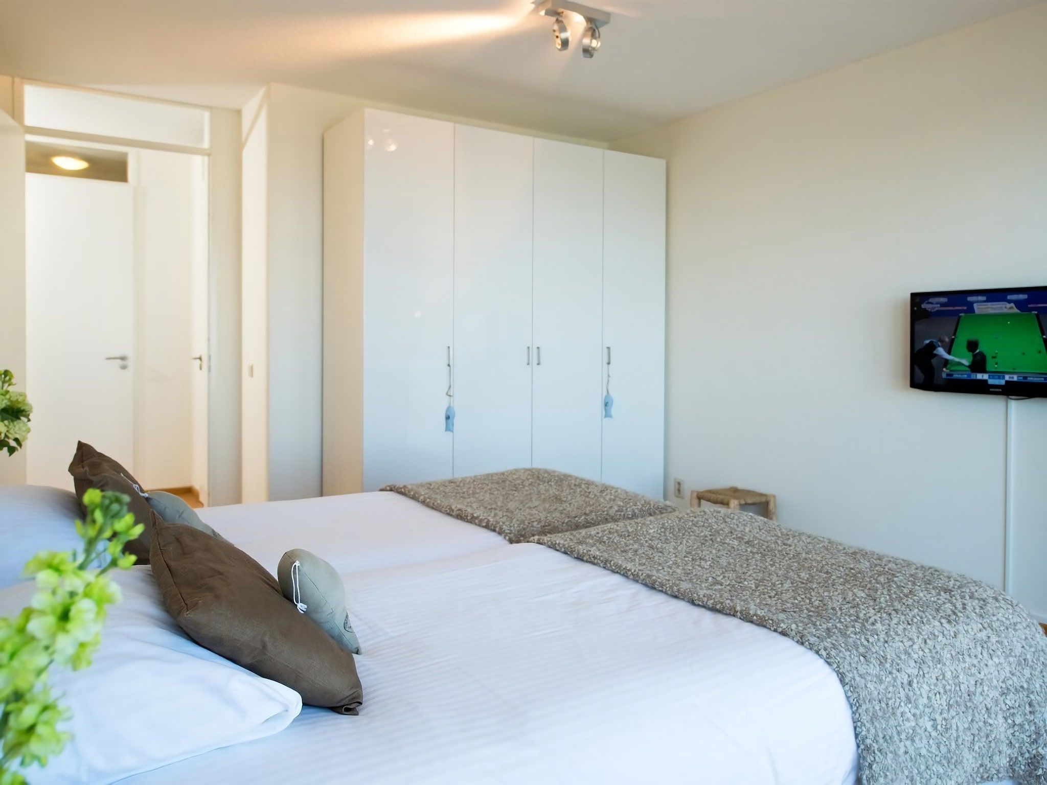 Een slaapkamer van Scheveningen Harbour 36 in Den Haag