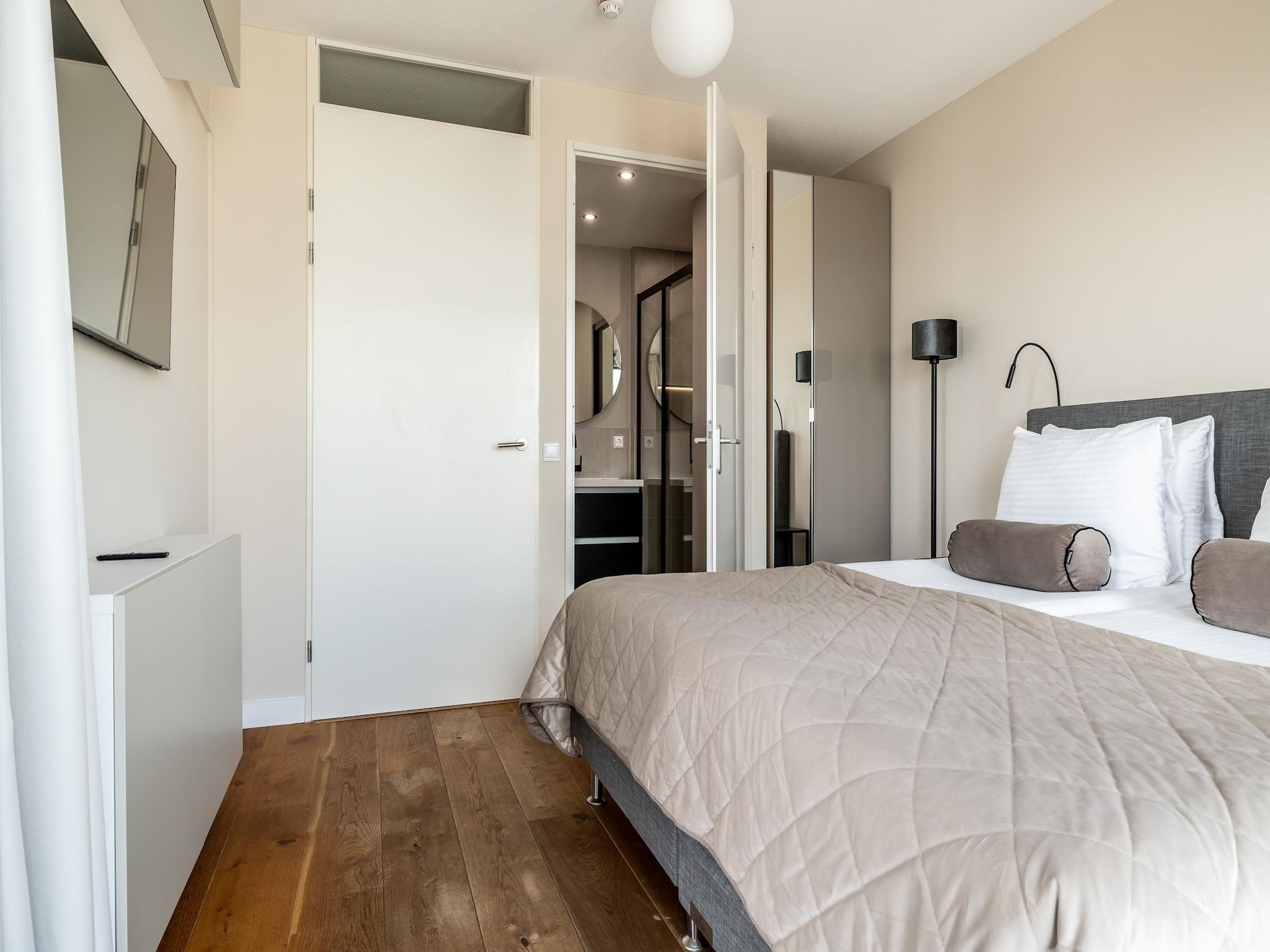 Een slaapkamer van Scheveningen Harbour 38C in Den Haag