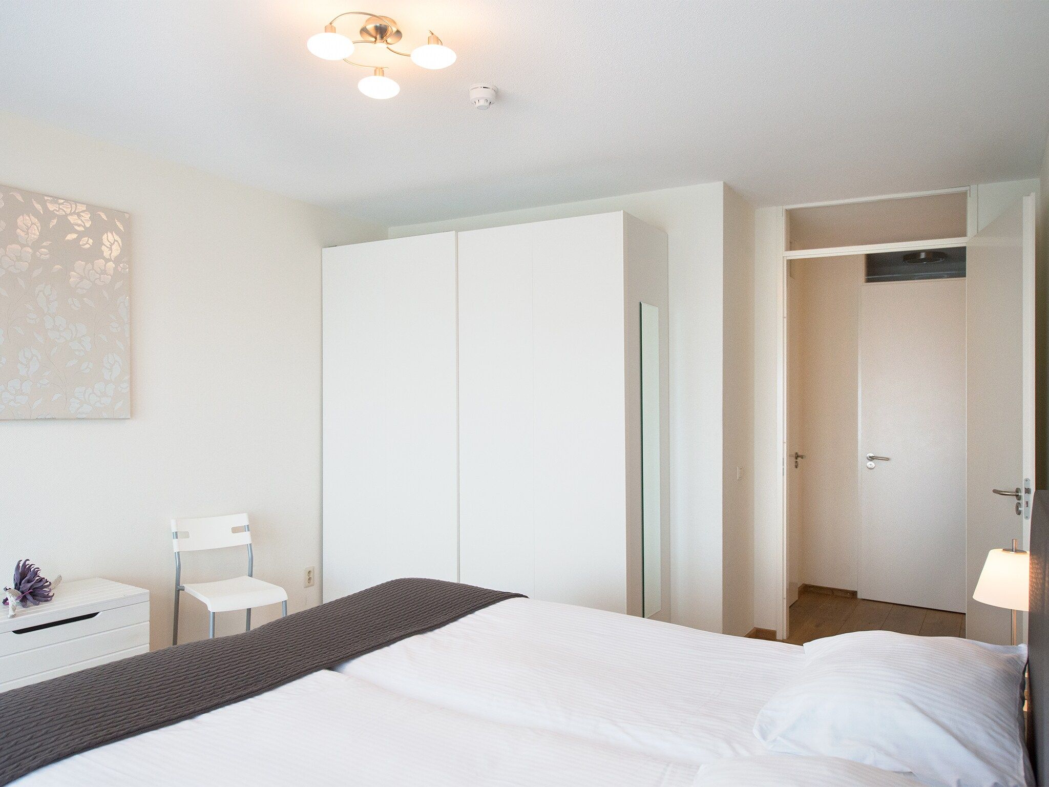 Een slaapkamer van Scheveningen Harbour 40 in Den Haag