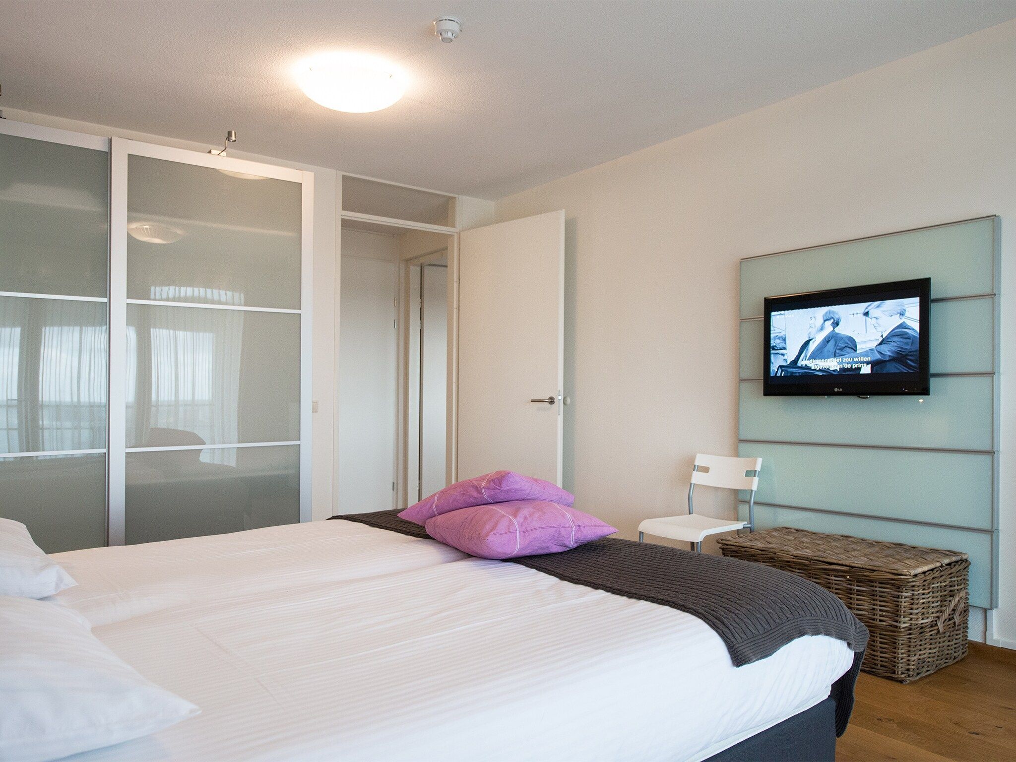 Een slaapkamer van Scheveningen Harbour 40 in Den Haag