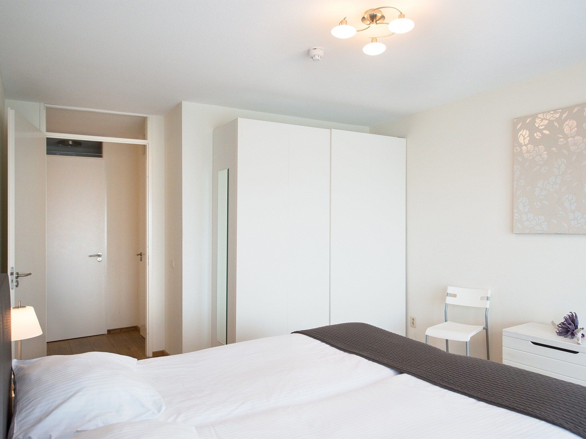 Een slaapkamer van Scheveningen Harbour 40 in Den Haag