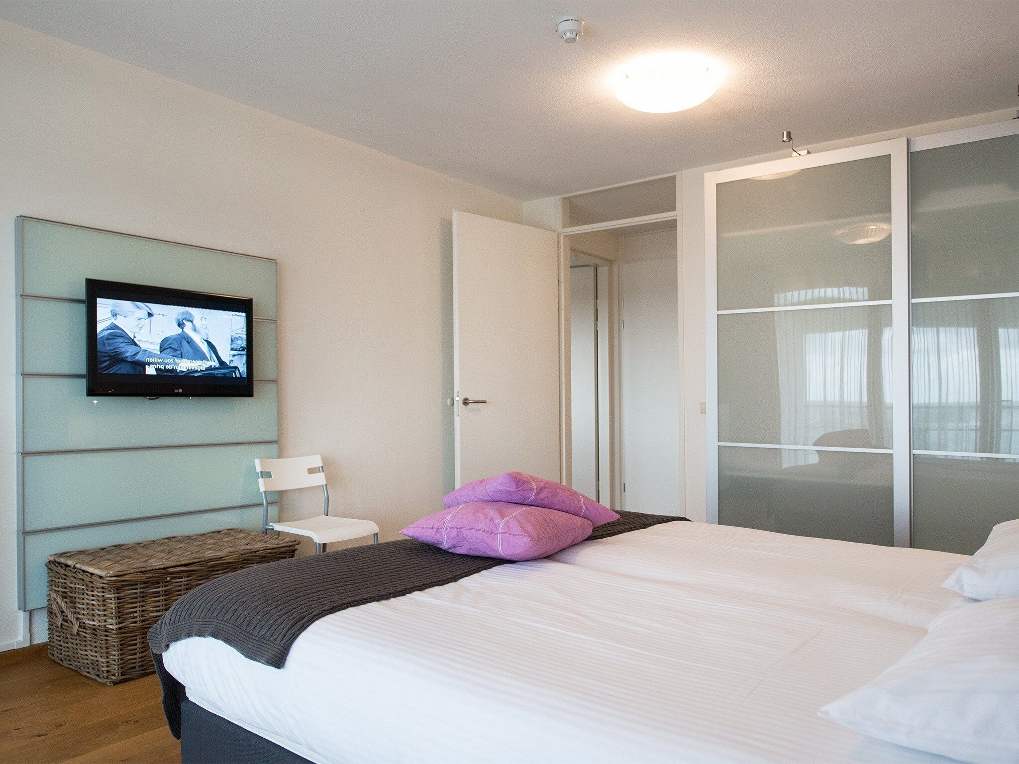 Een slaapkamer van Scheveningen Harbour 40 in Den Haag
