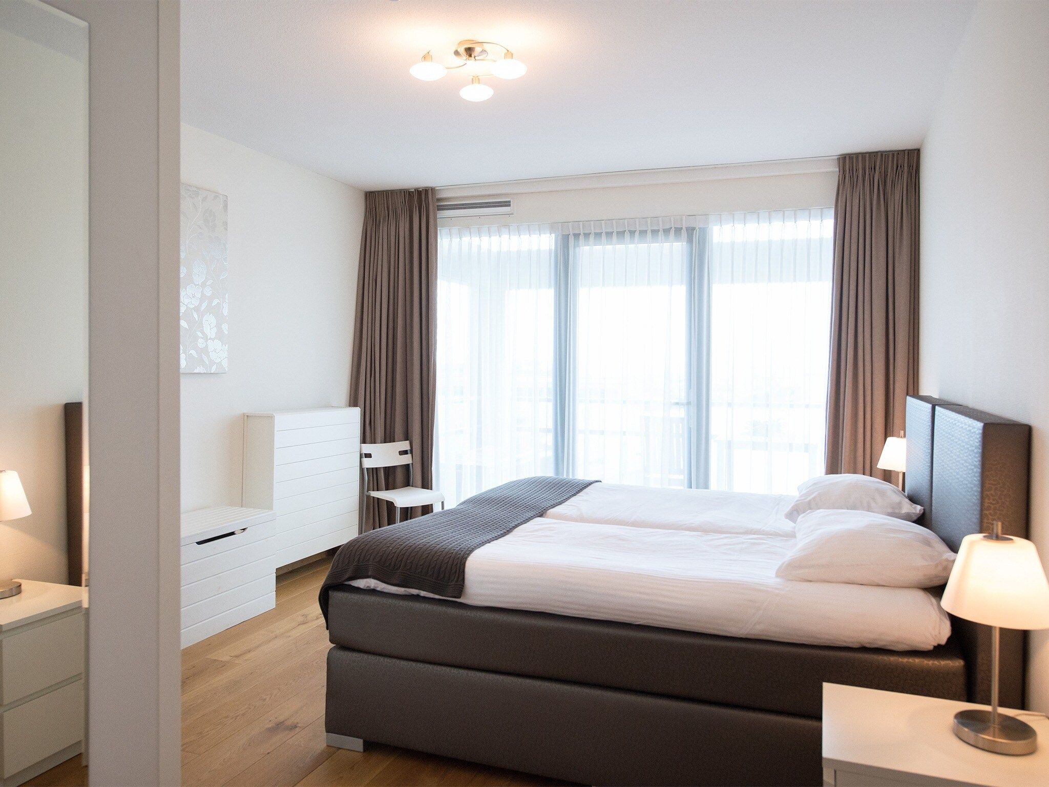 Een slaapkamer van Scheveningen Harbour 40 in Den Haag