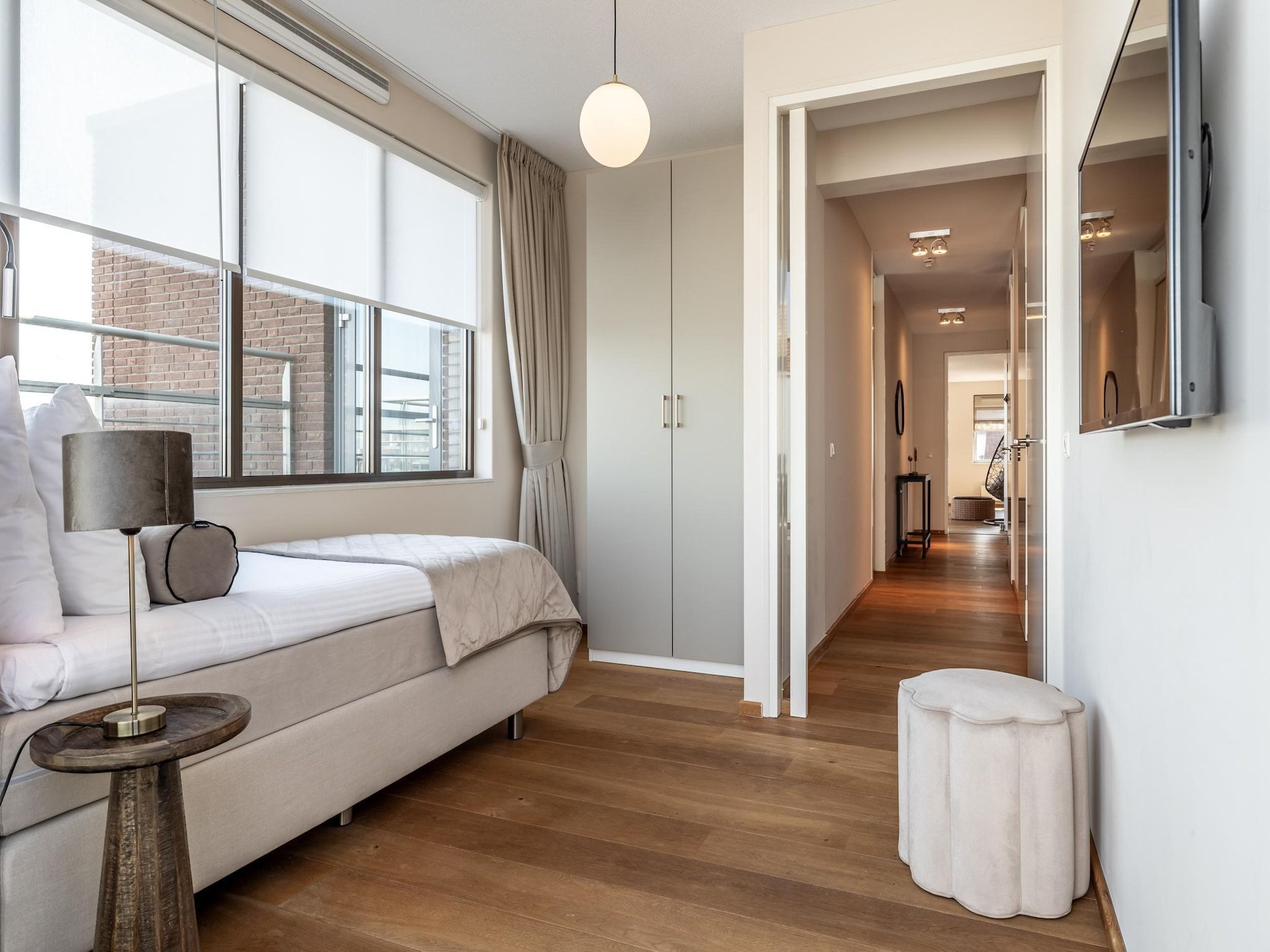 Een slaapkamer van Scheveningen Harbour 42A in Den Haag
