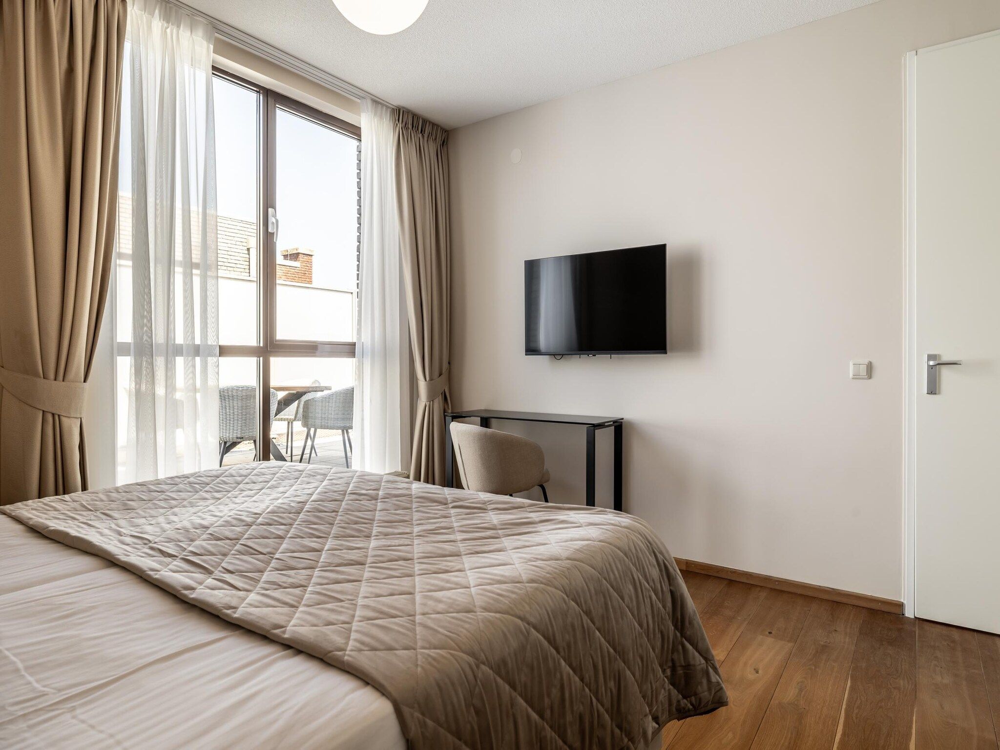Een slaapkamer van Scheveningen Harbour 42A in Den Haag
