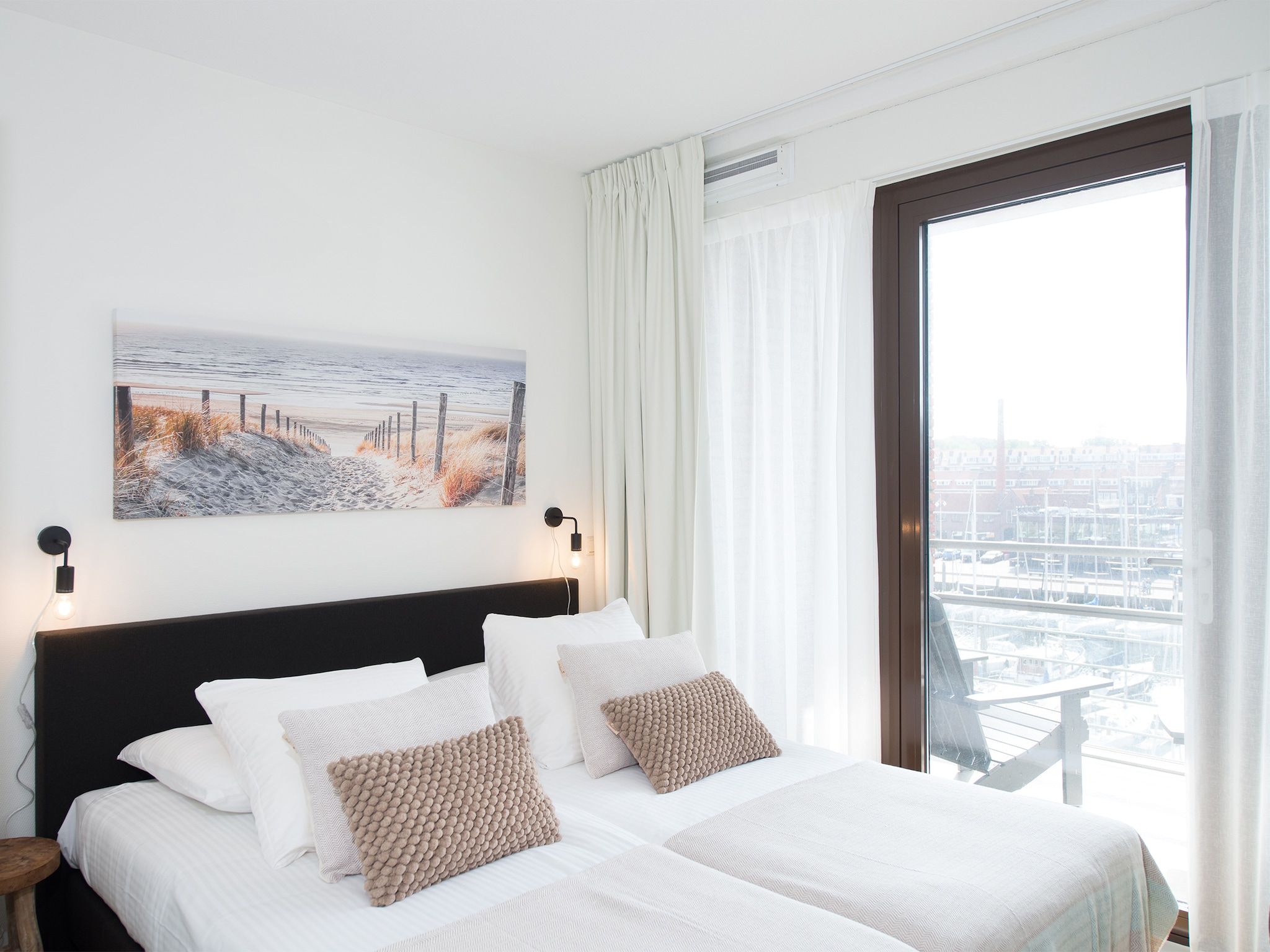 Een slaapkamer van Scheveningen Harbour 48A in Den Haag