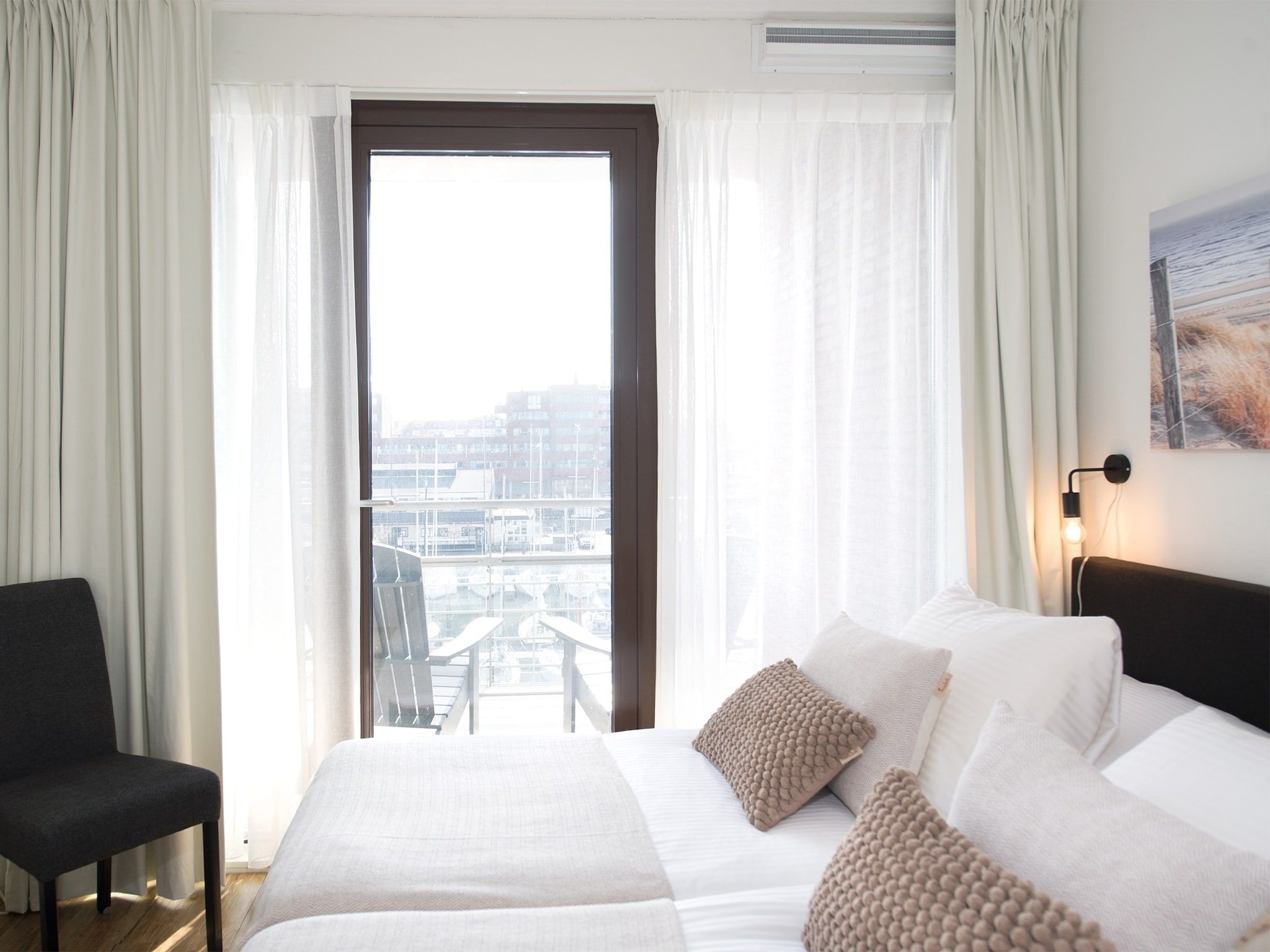 Een slaapkamer van Scheveningen Harbour 48A in Den Haag