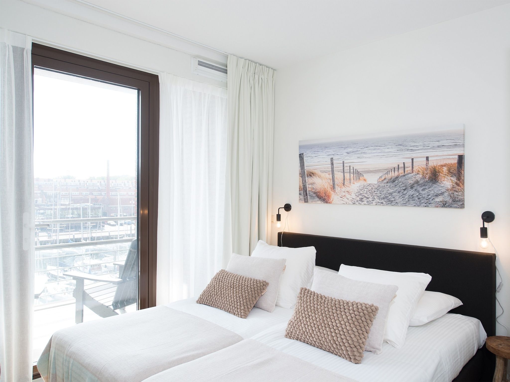 Een slaapkamer van Scheveningen Harbour 48A in Den Haag