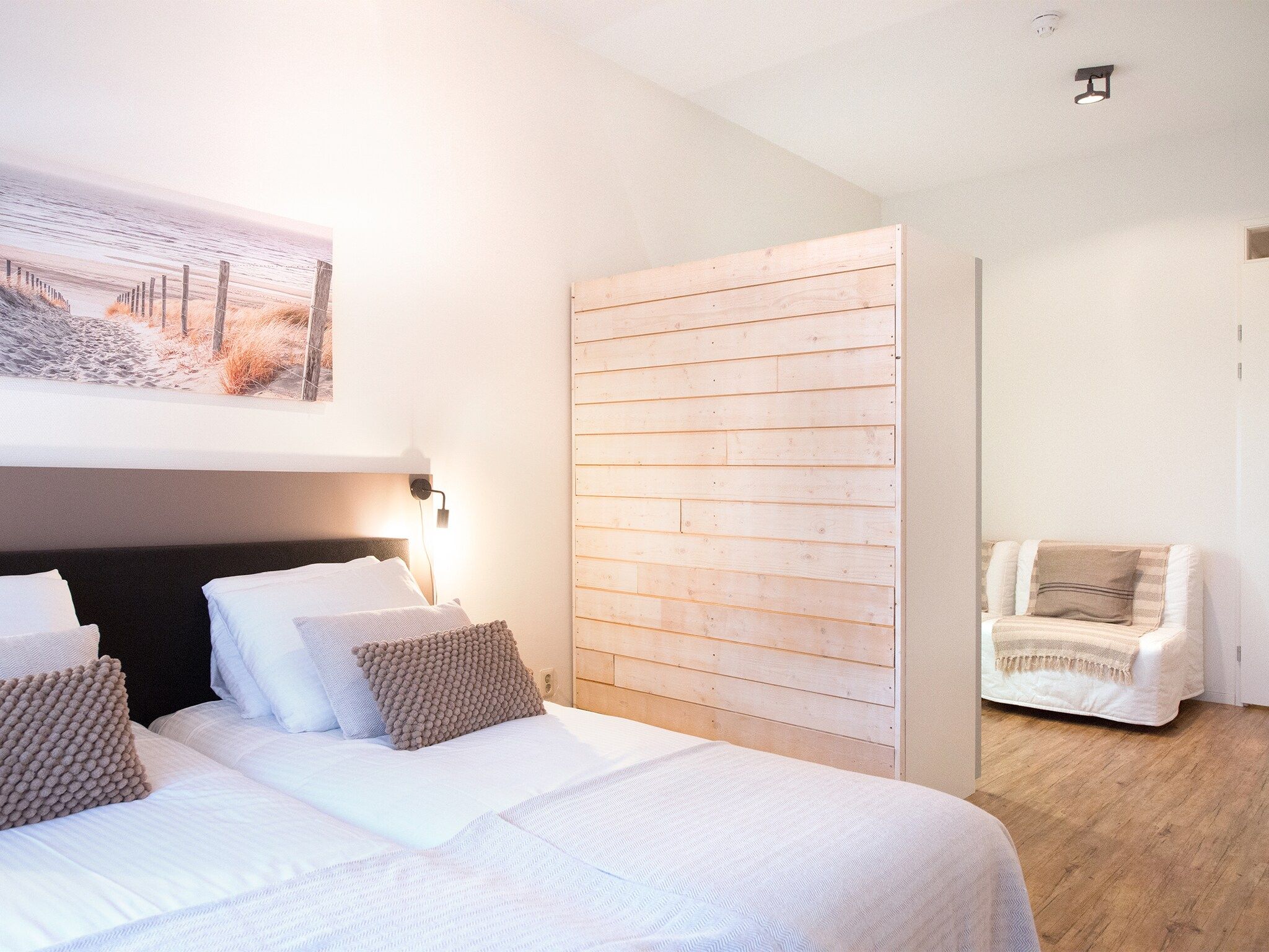 Een slaapkamer van Scheveningen Harbour 56C in Den Haag