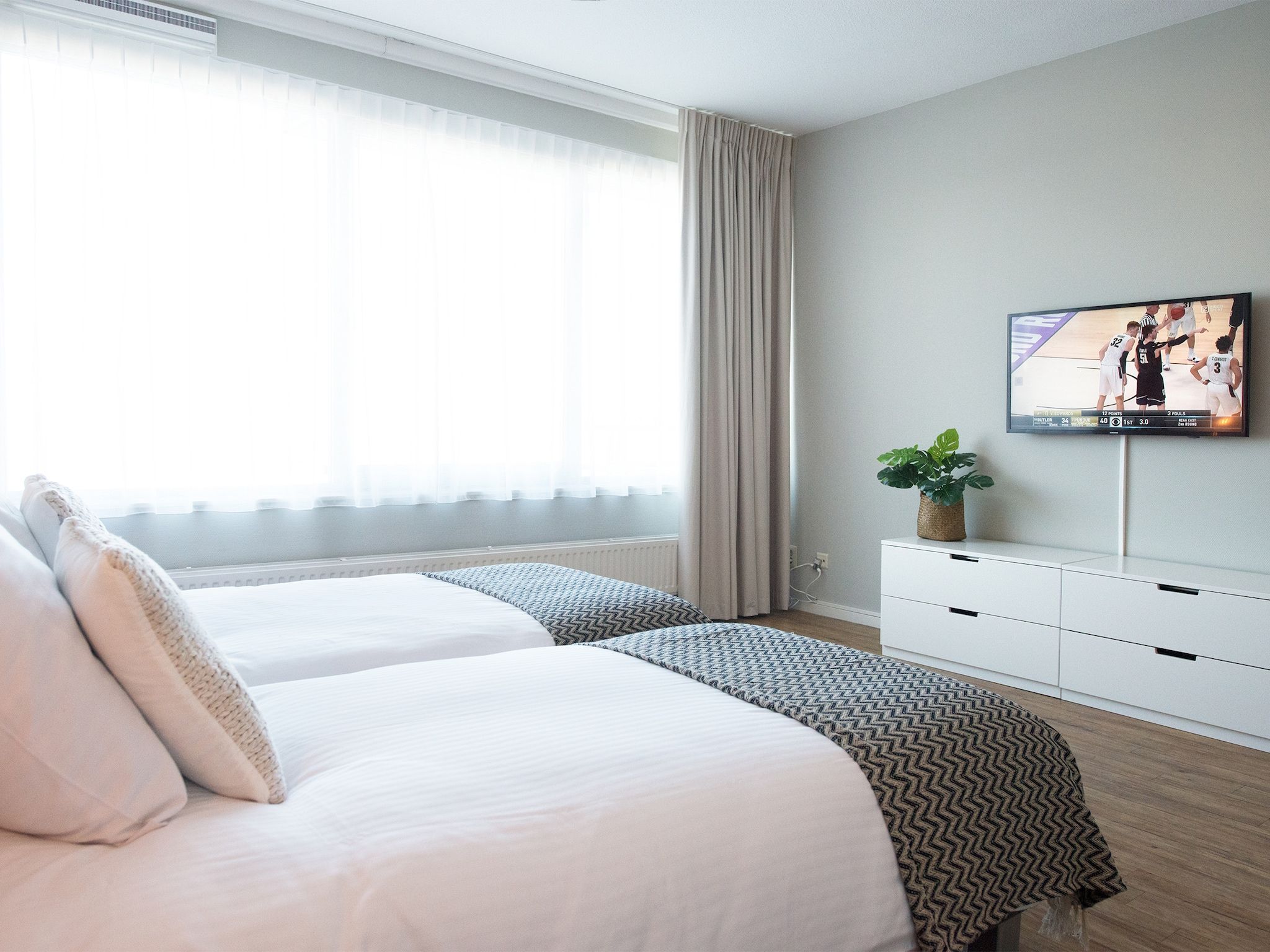 Een slaapkamer van Scheveningen Harbour 58 in Den Haag