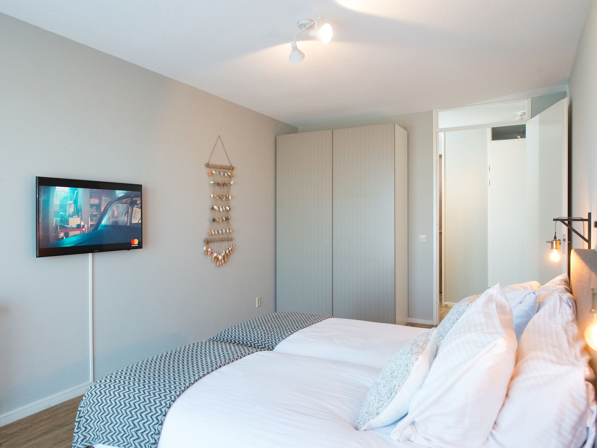 Een slaapkamer van Scheveningen Harbour 58 in Den Haag