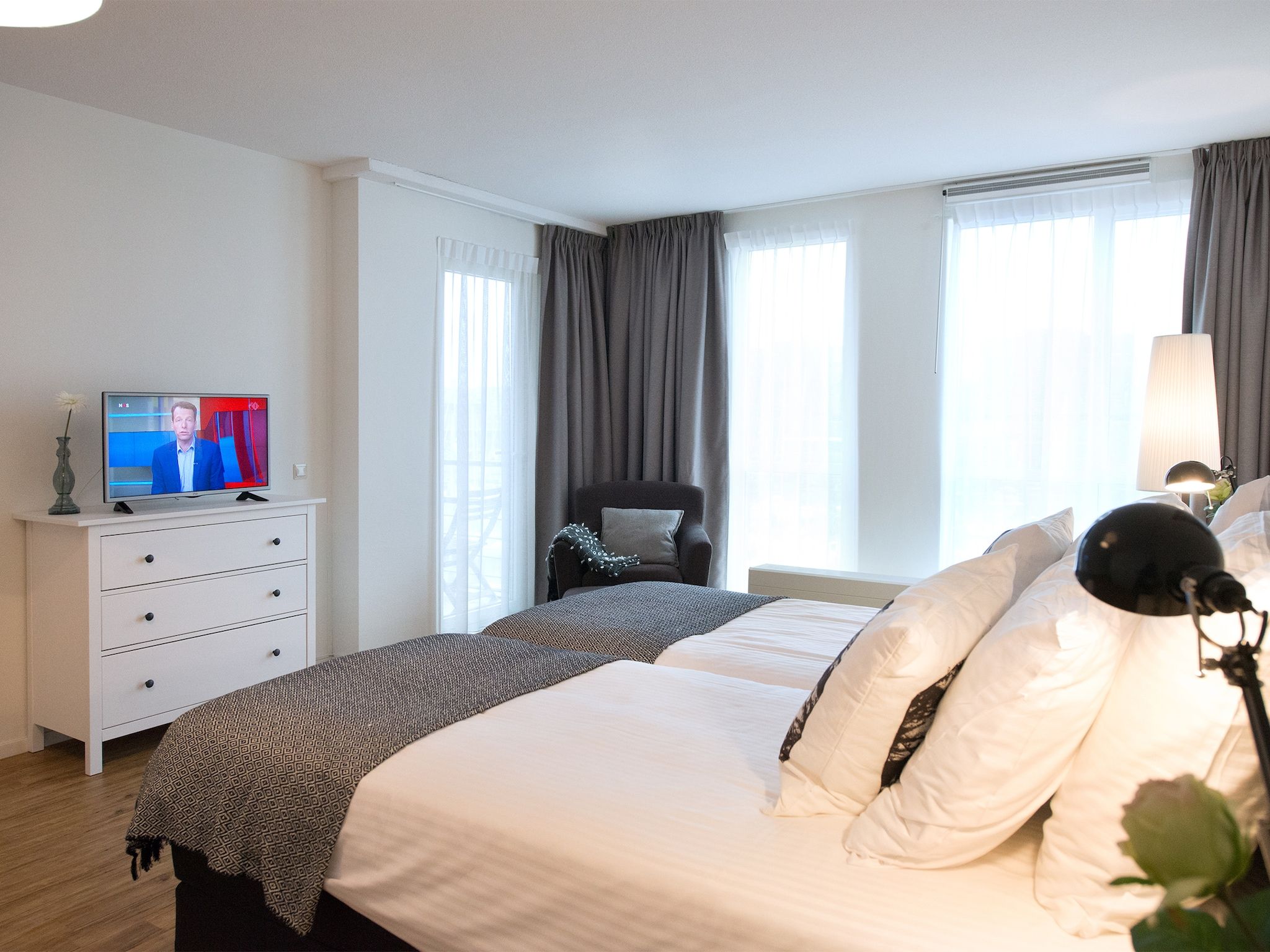 Een slaapkamer van Scheveningen Harbour 60B in Den Haag