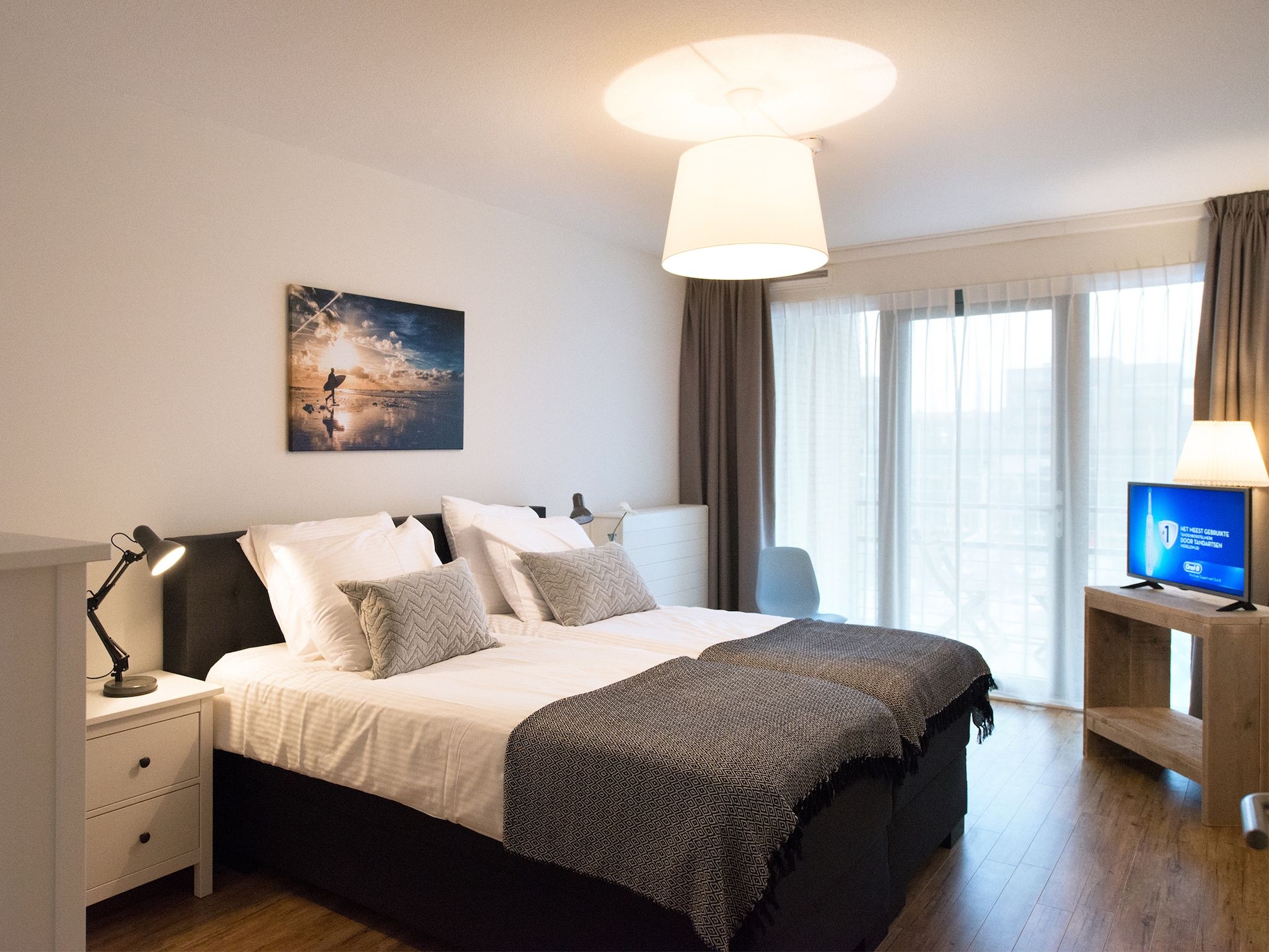 Een slaapkamer van Scheveningen Harbour 60B in Den Haag