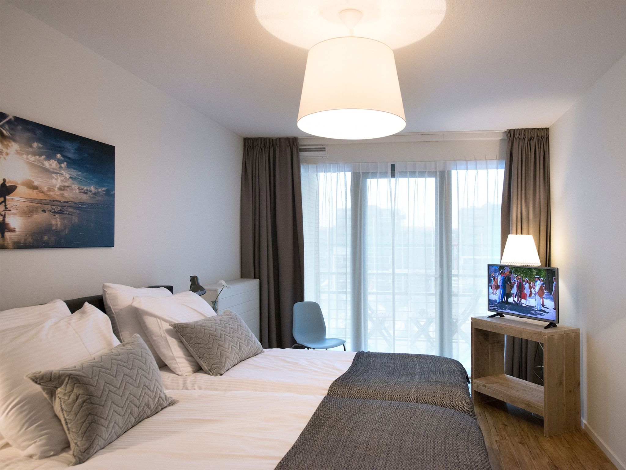 Een slaapkamer van Scheveningen Harbour 60B in Den Haag