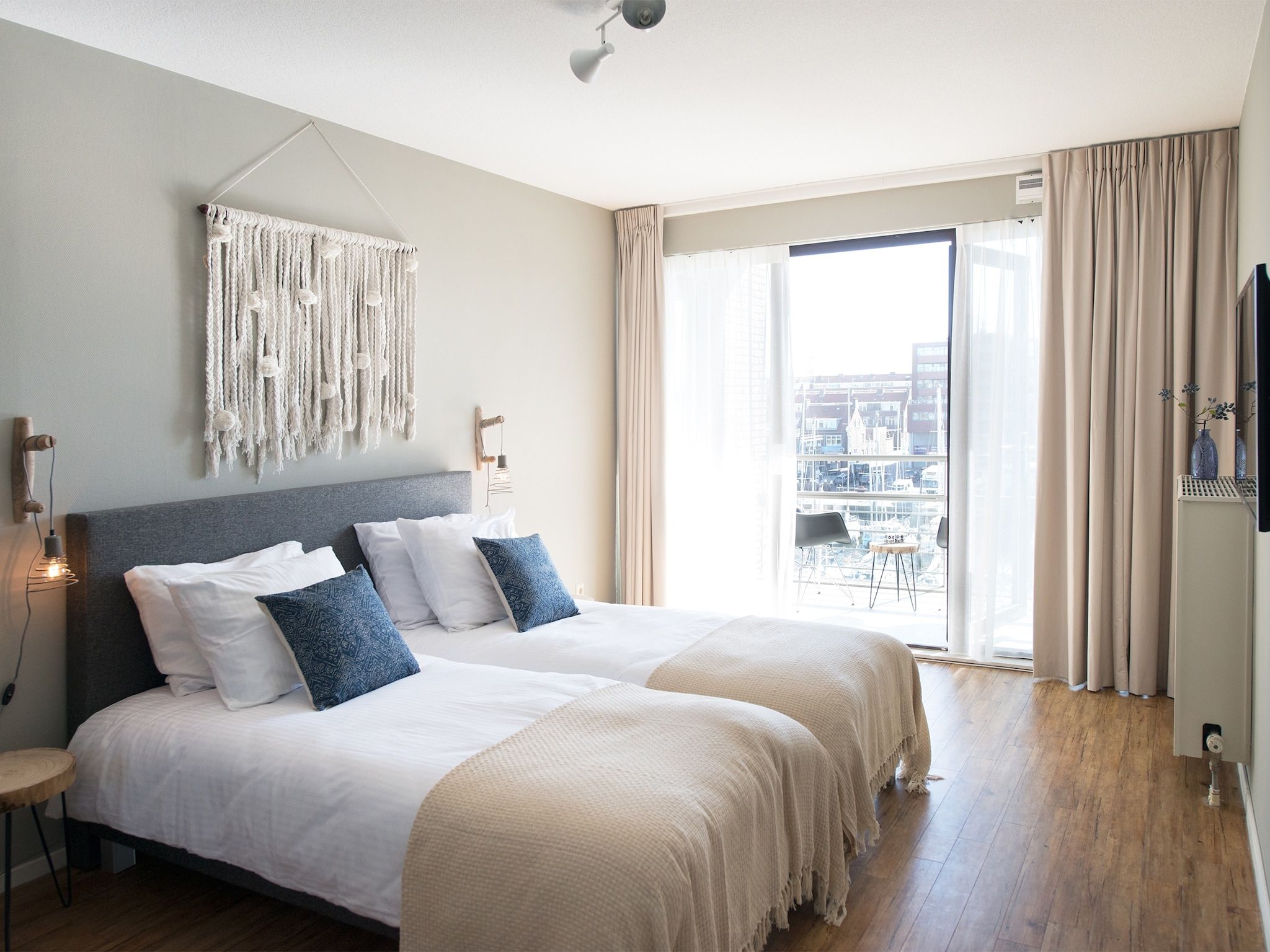 Een slaapkamer van Scheveningen Harbour 62A in Den Haag