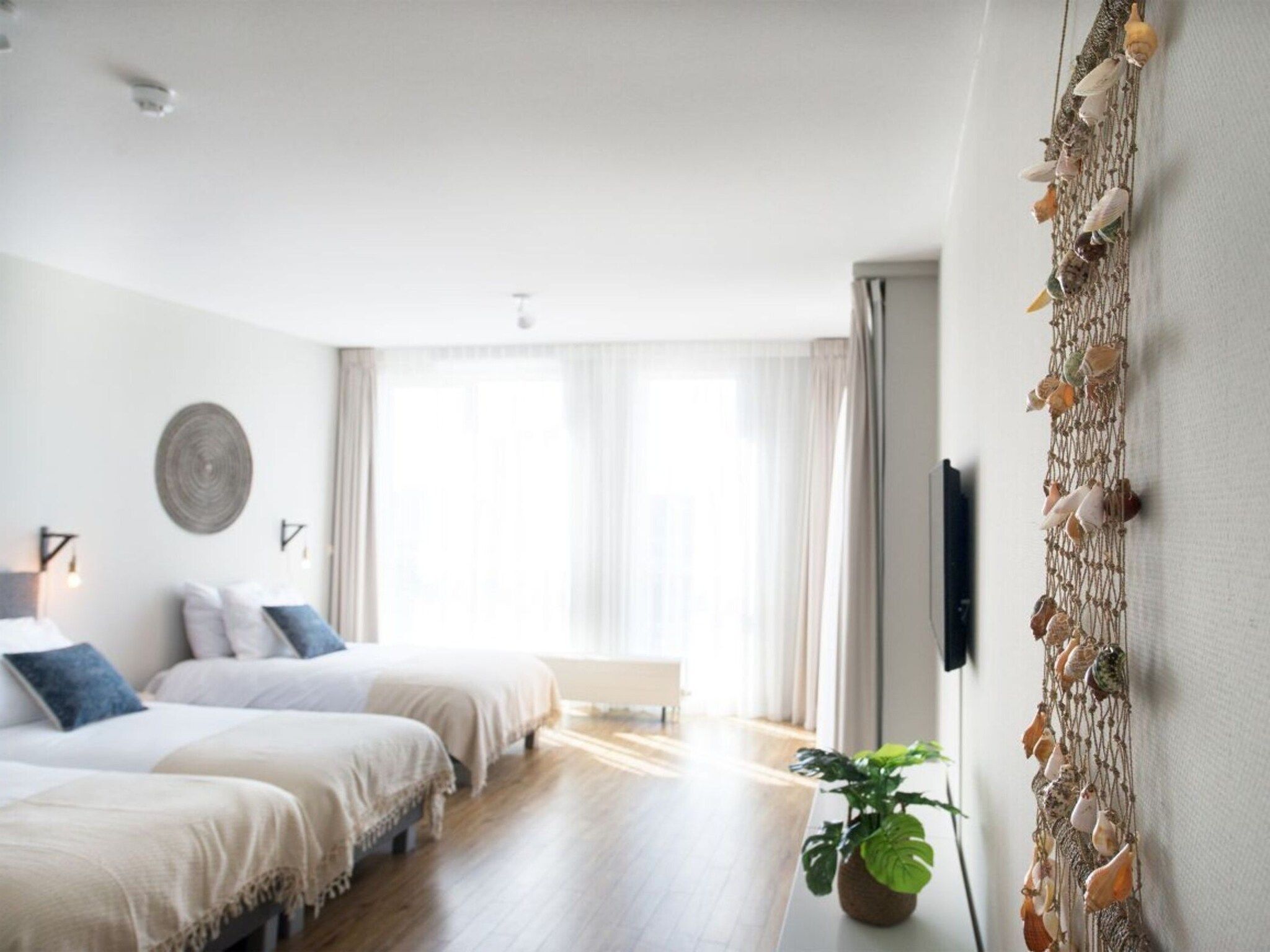 Een slaapkamer van Scheveningen Harbour 68B in Den Haag