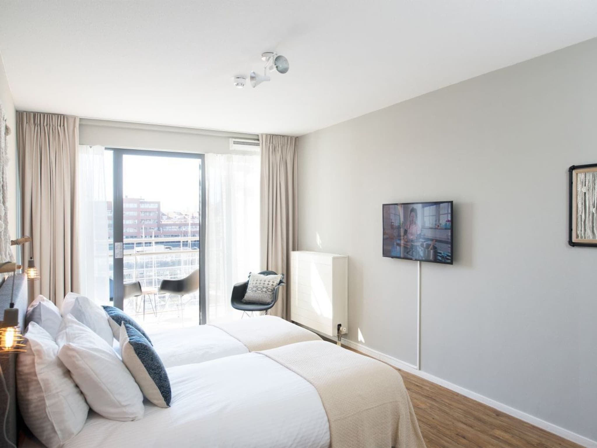 Een slaapkamer van Scheveningen Harbour 68B in Den Haag