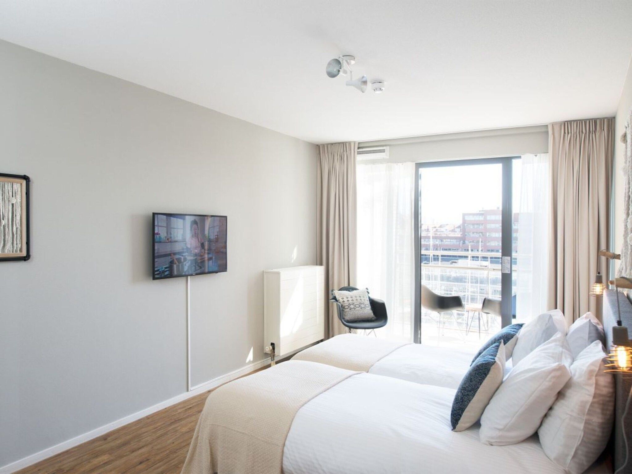 Een slaapkamer van Scheveningen Harbour 68B in Den Haag