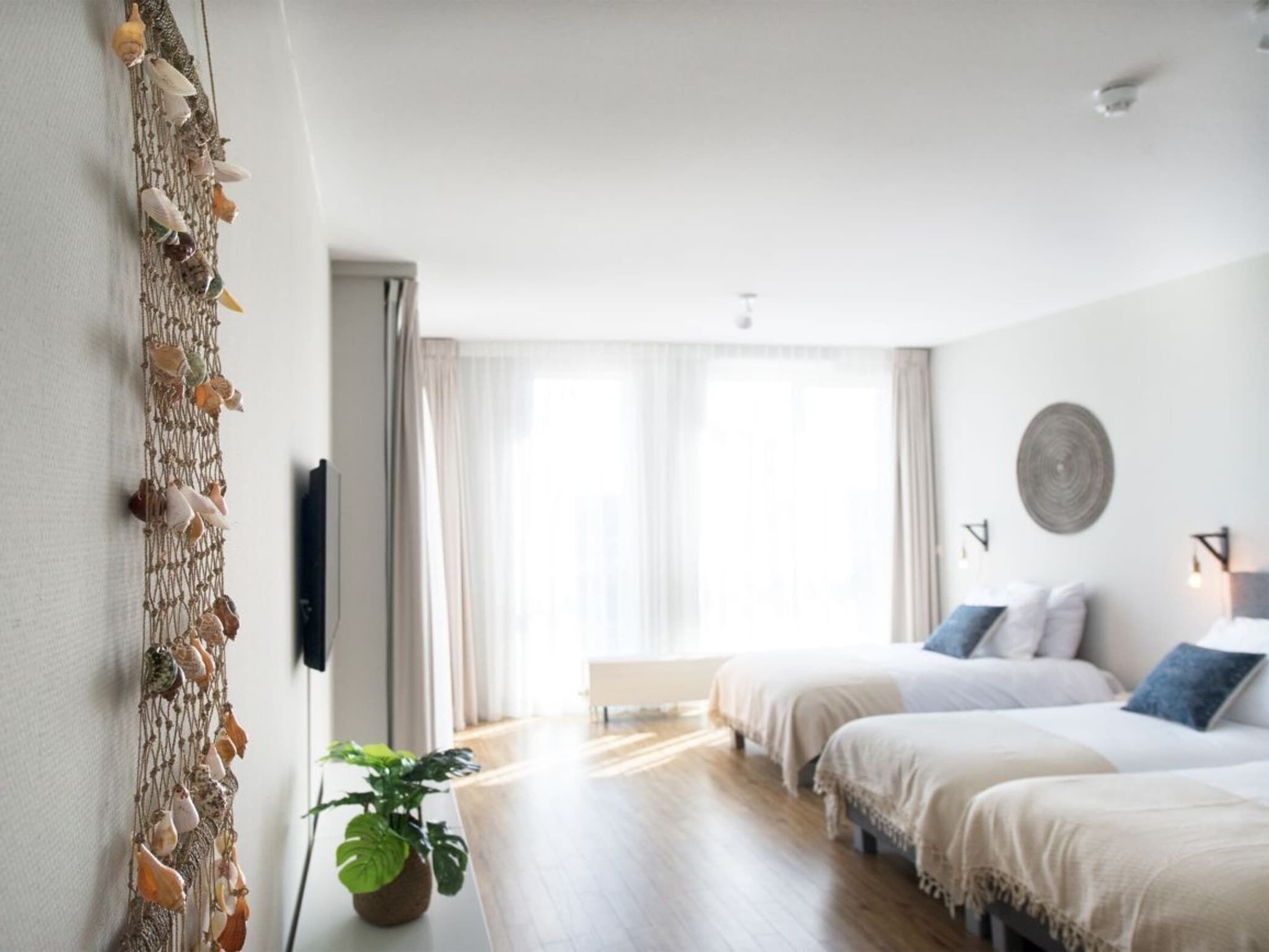 Een slaapkamer van Scheveningen Harbour 68B in Den Haag