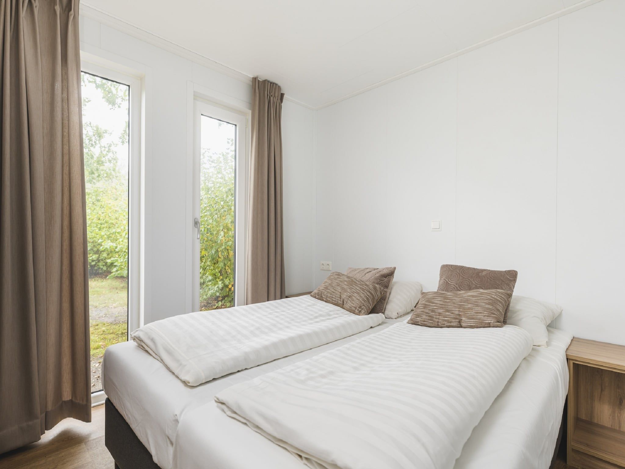 Een slaapkamer van Vakantiepark Mölke 30 in Zuna