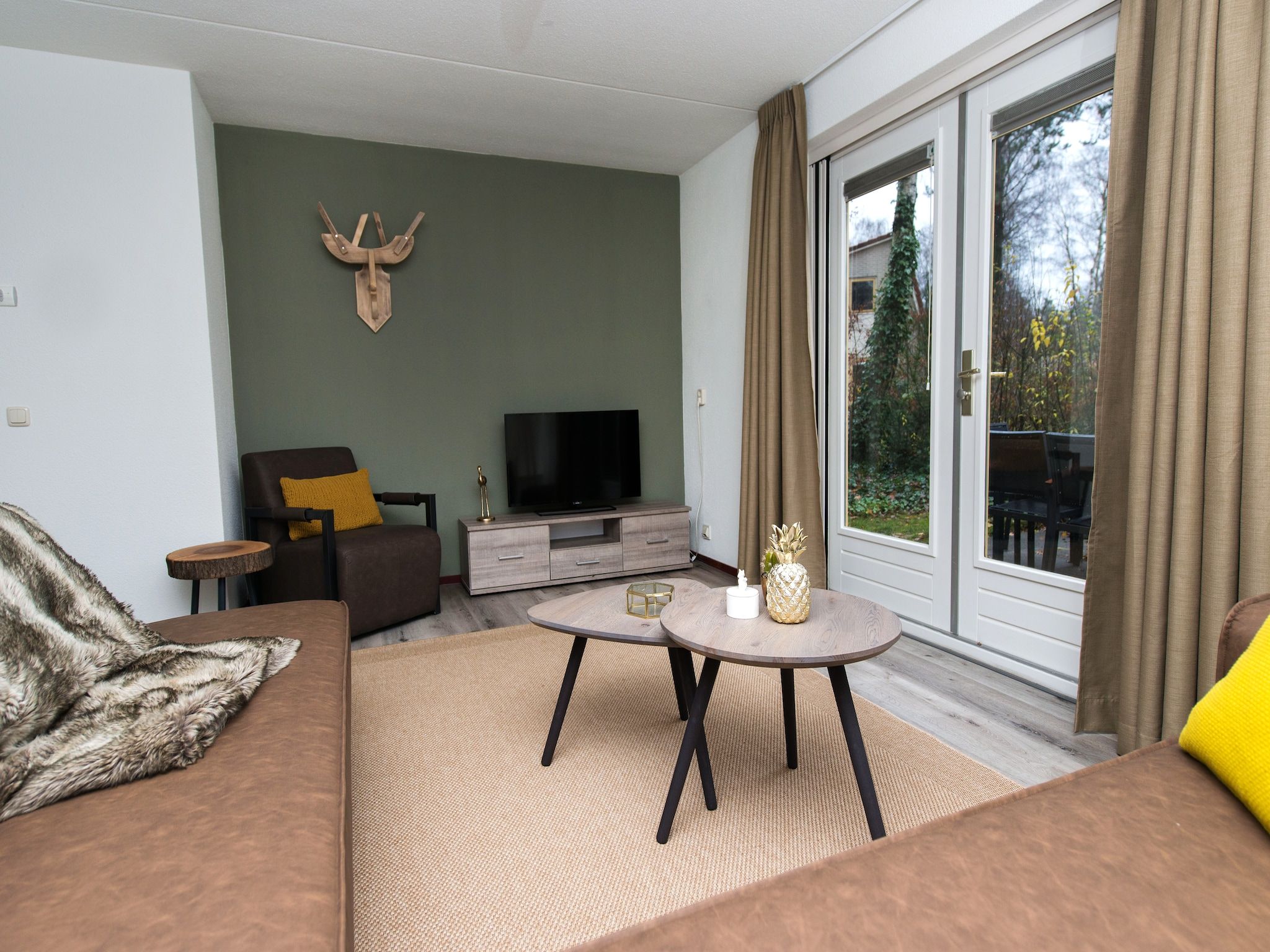 De woonkamer van Bungalowpark Hoenderloo 6 in Hoenderloo