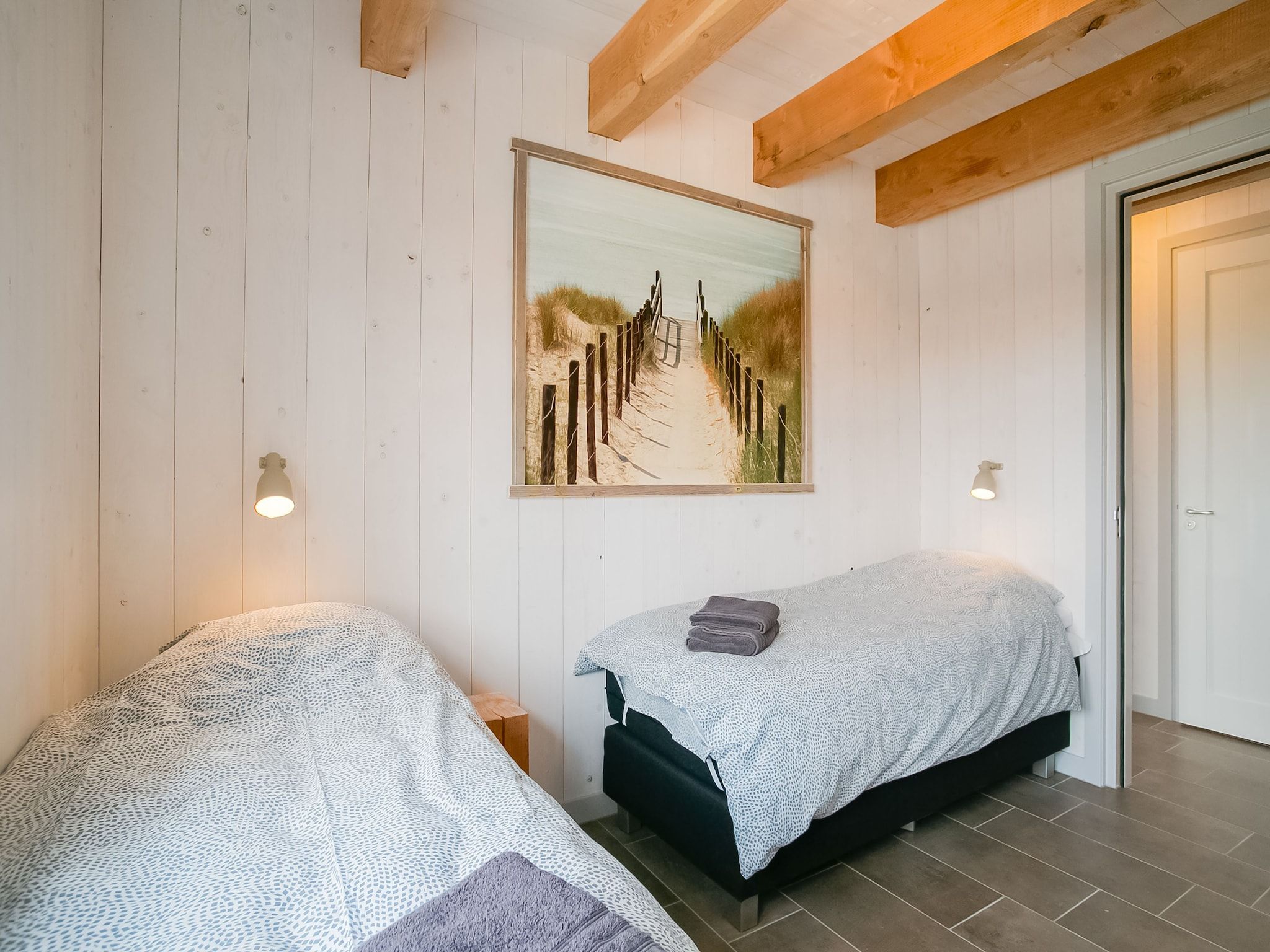 Een slaapkamer van Hazenborgh - Duinhuis 2 in Callantsoog