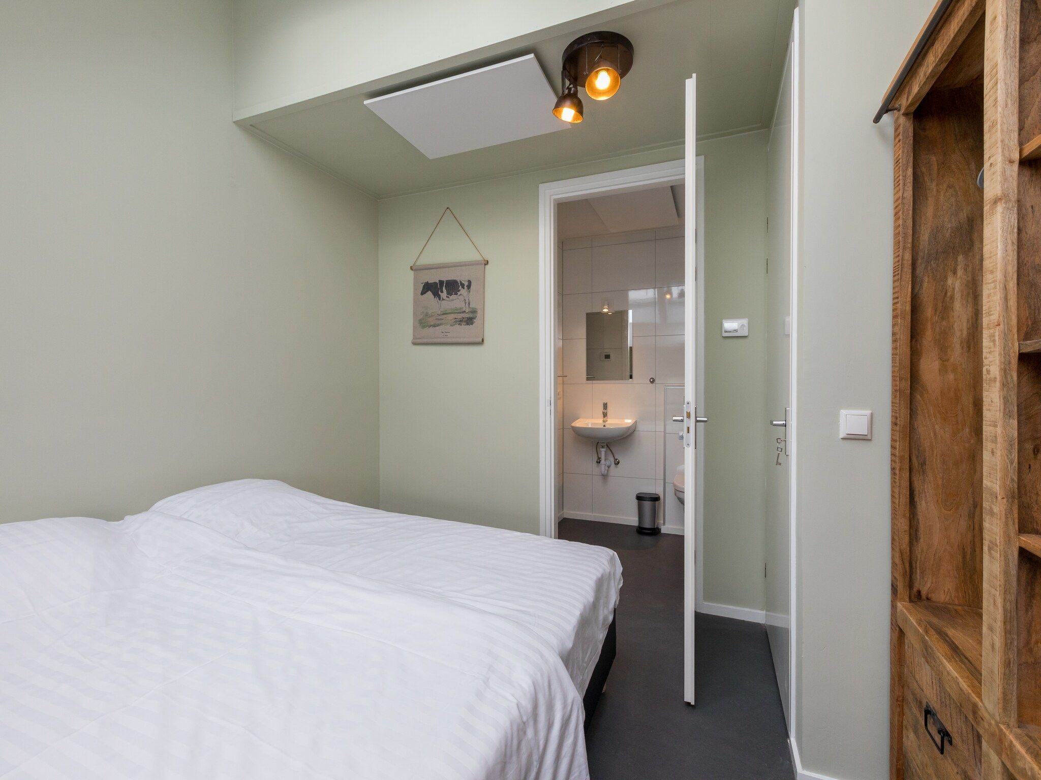 Een slaapkamer van Vroondijk 2-Zeebloesempje in Vrouwenpolder