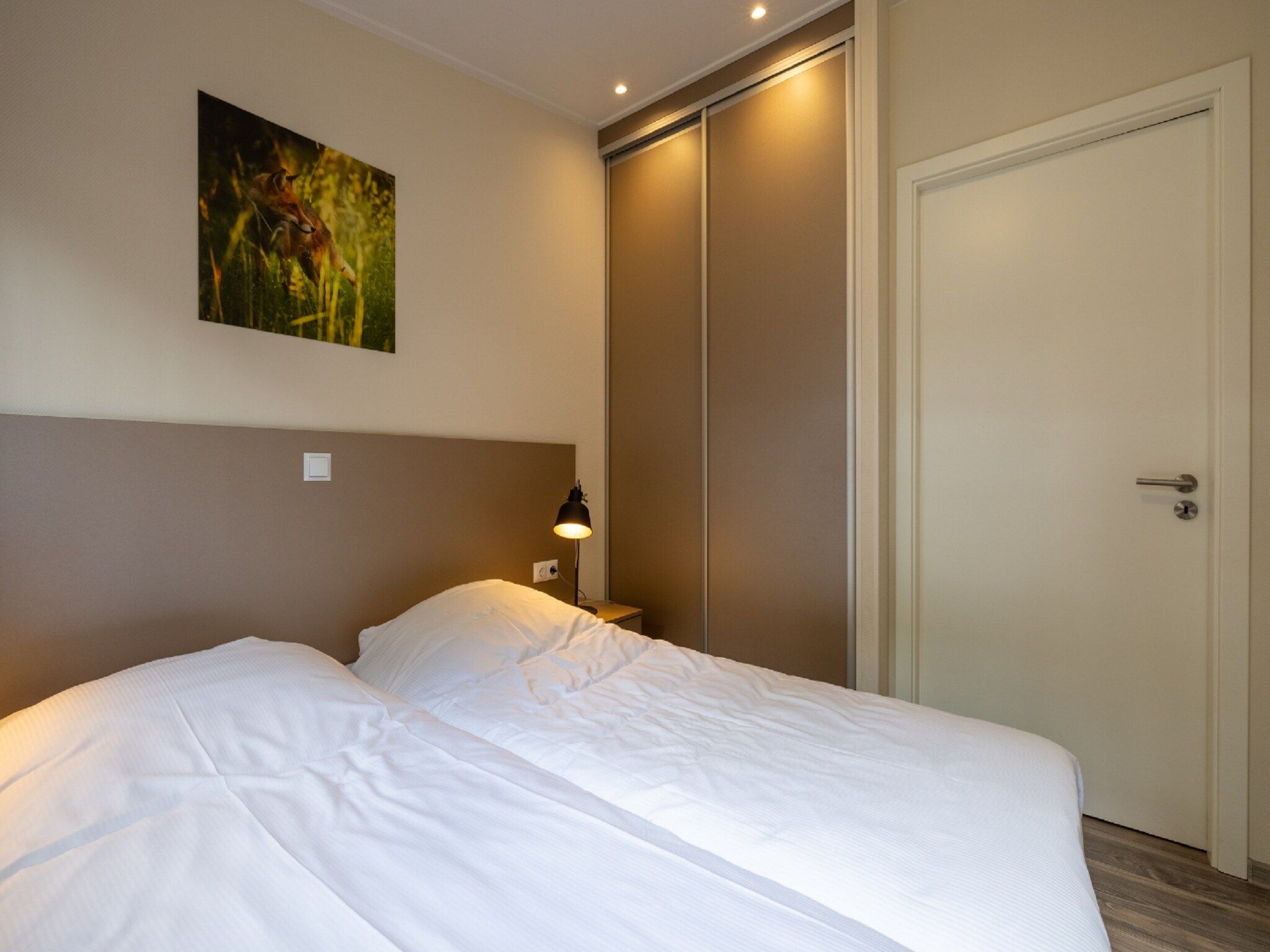 Een slaapkamer van Vakantiepark De Rimboe & De Woeste Hoogte 20 in Hoenderloo