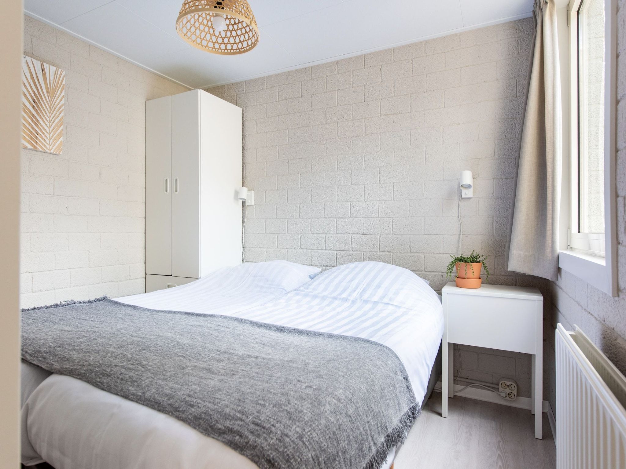 Een slaapkamer van Vakantiepark de Berkenhorst 10 in Kootwijk