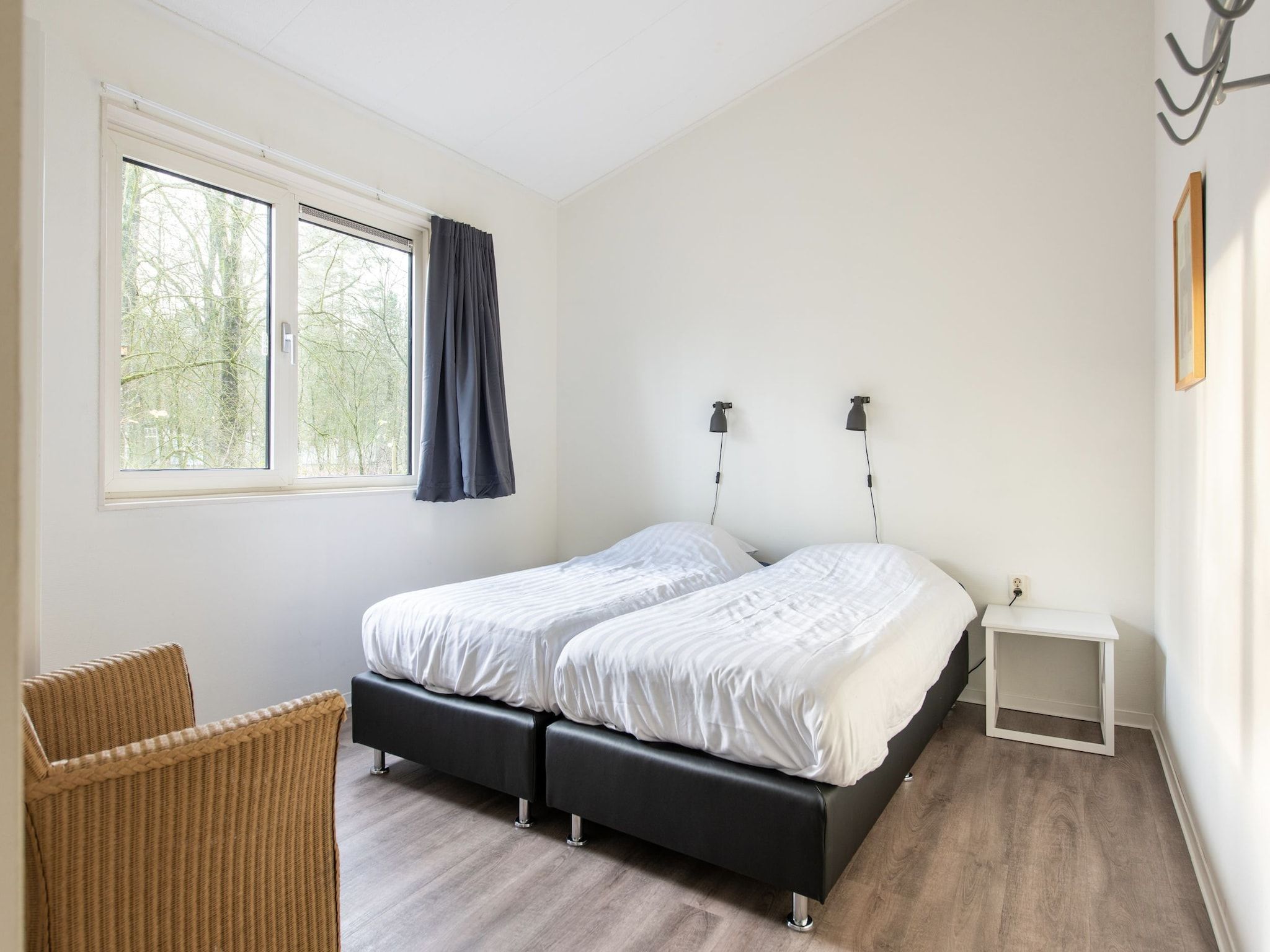 Een slaapkamer van Vakantiepark de Berkenhorst 11 in Kootwijk
