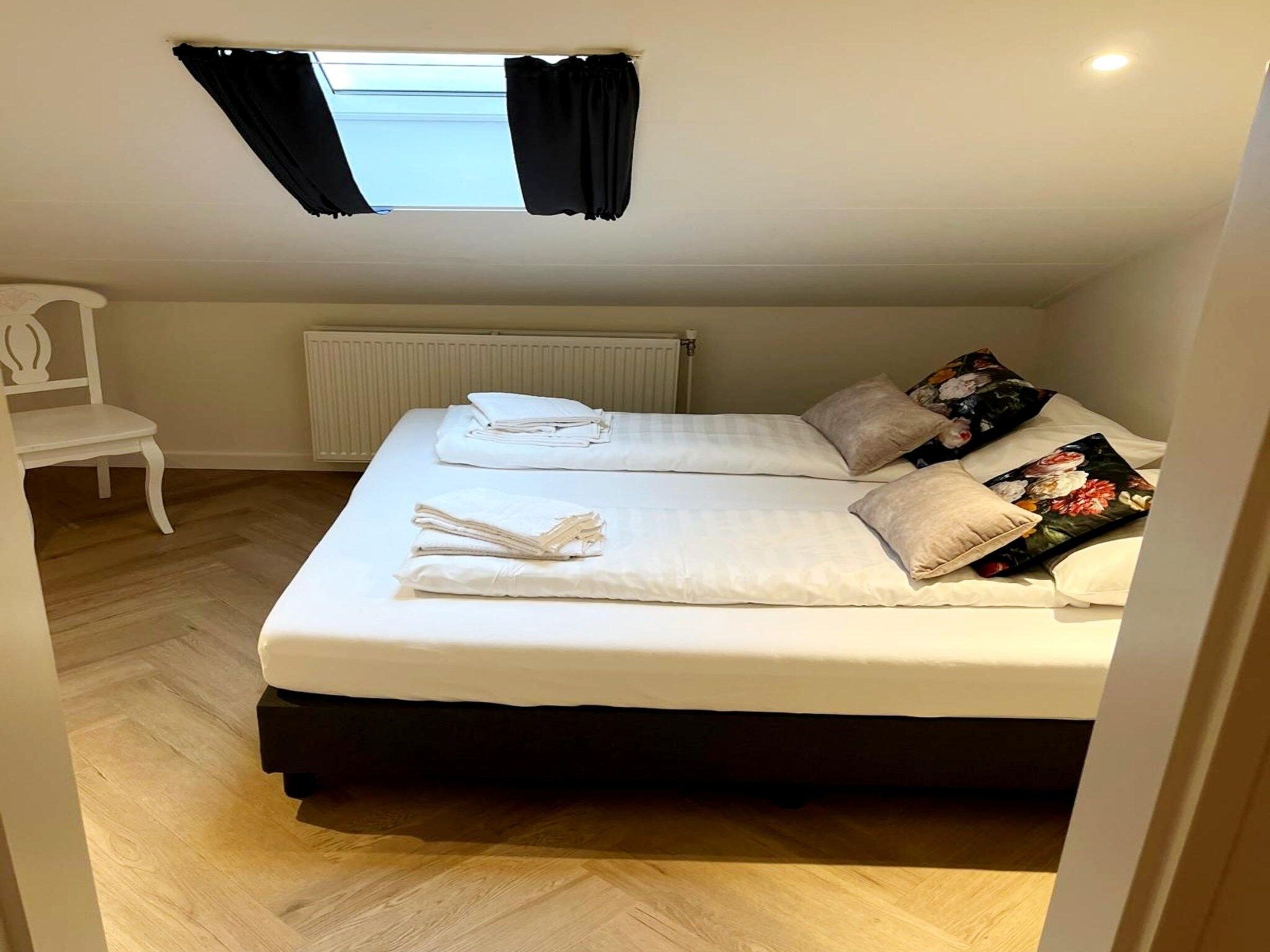 Een slaapkamer van Valleyview Cottages - NR13 in Voerendaal