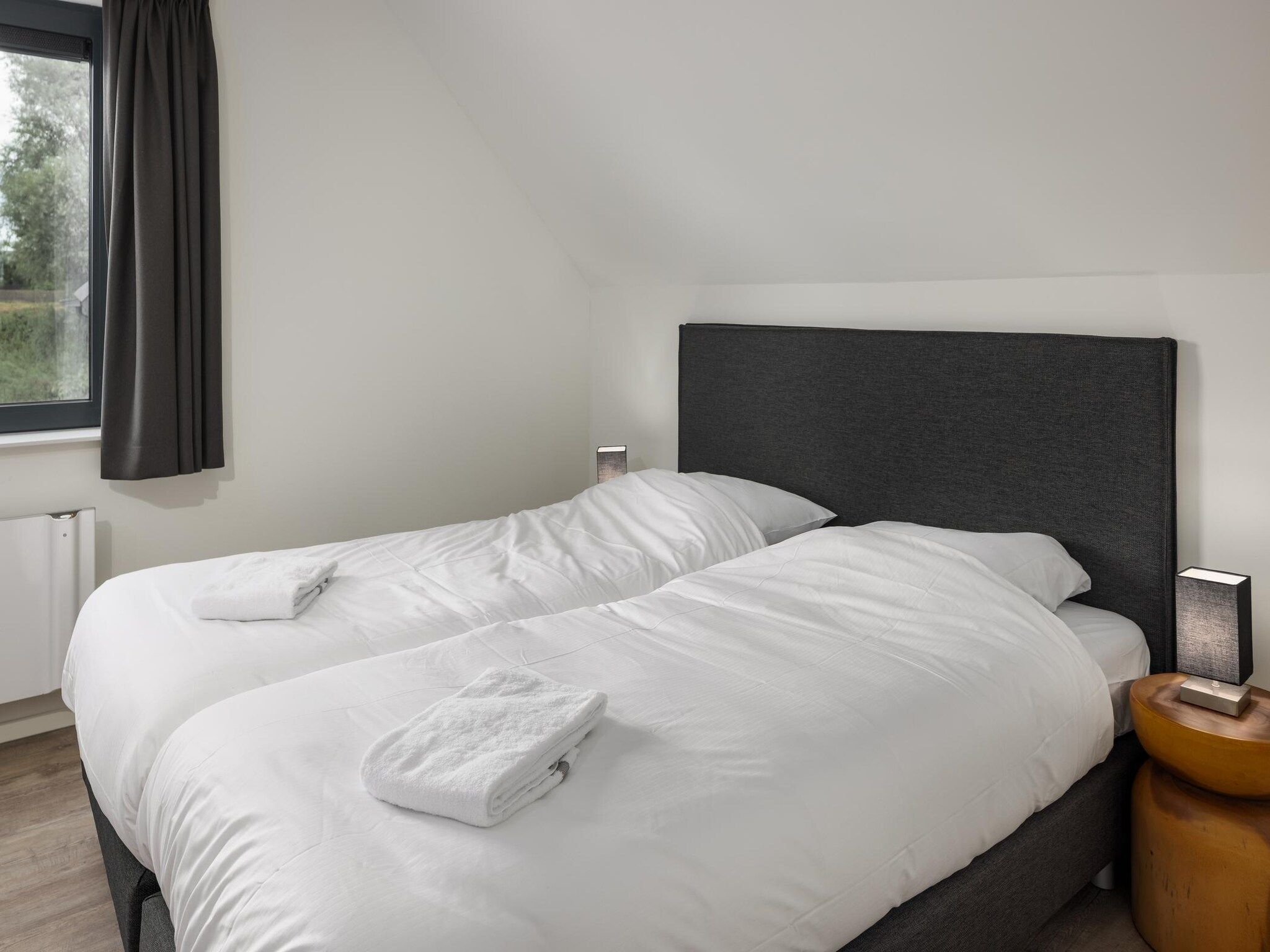 Een slaapkamer van Park Veerse Kreek 5 in Wolphaartsdijk
