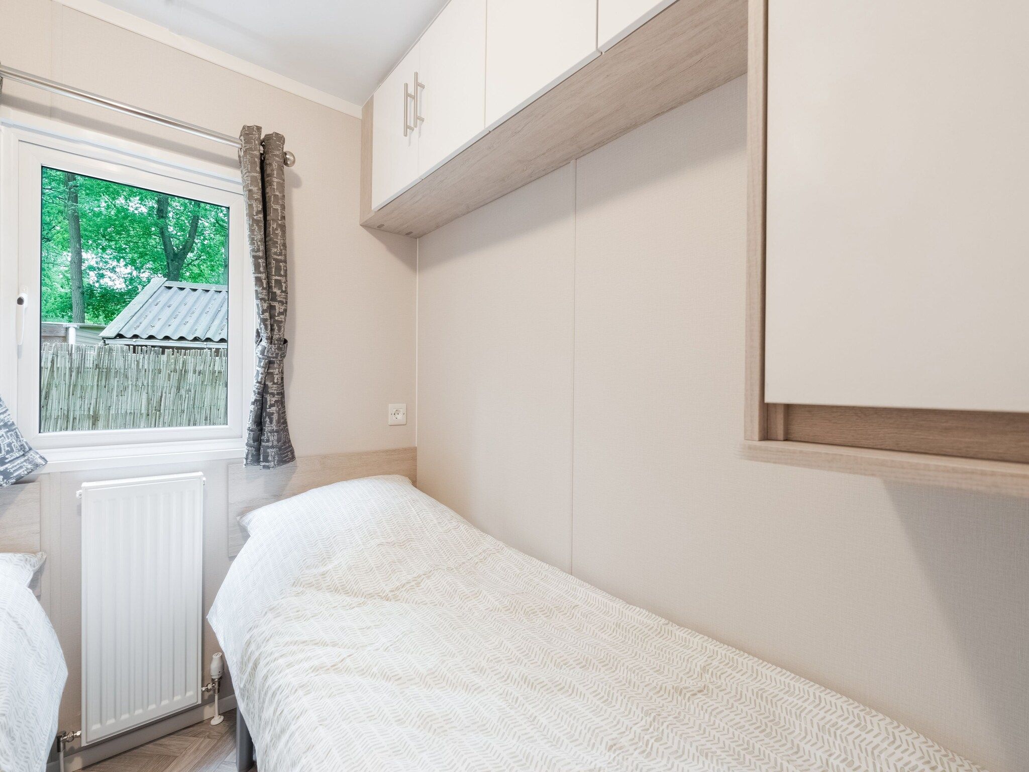 Een slaapkamer van Chalet in Vledder in Vledder