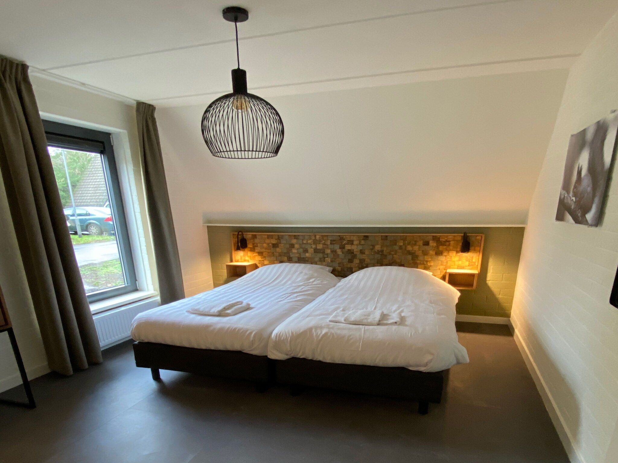 Een slaapkamer van Vakantiepark de Katjeskelder 20 in Oosterhout