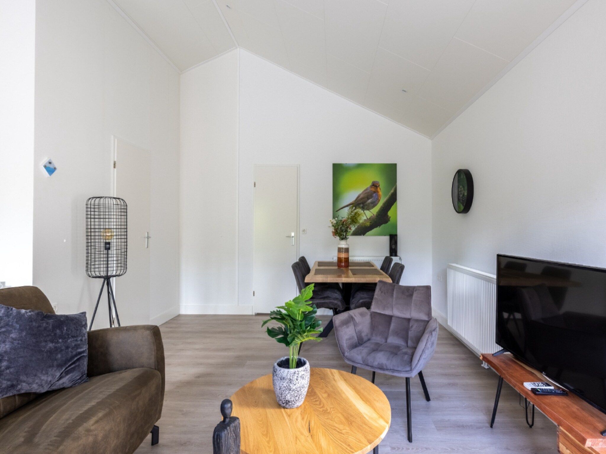 De woonkamer van Vakantiepark De Rimboe & De Woeste Hoogte 21 in Hoenderloo