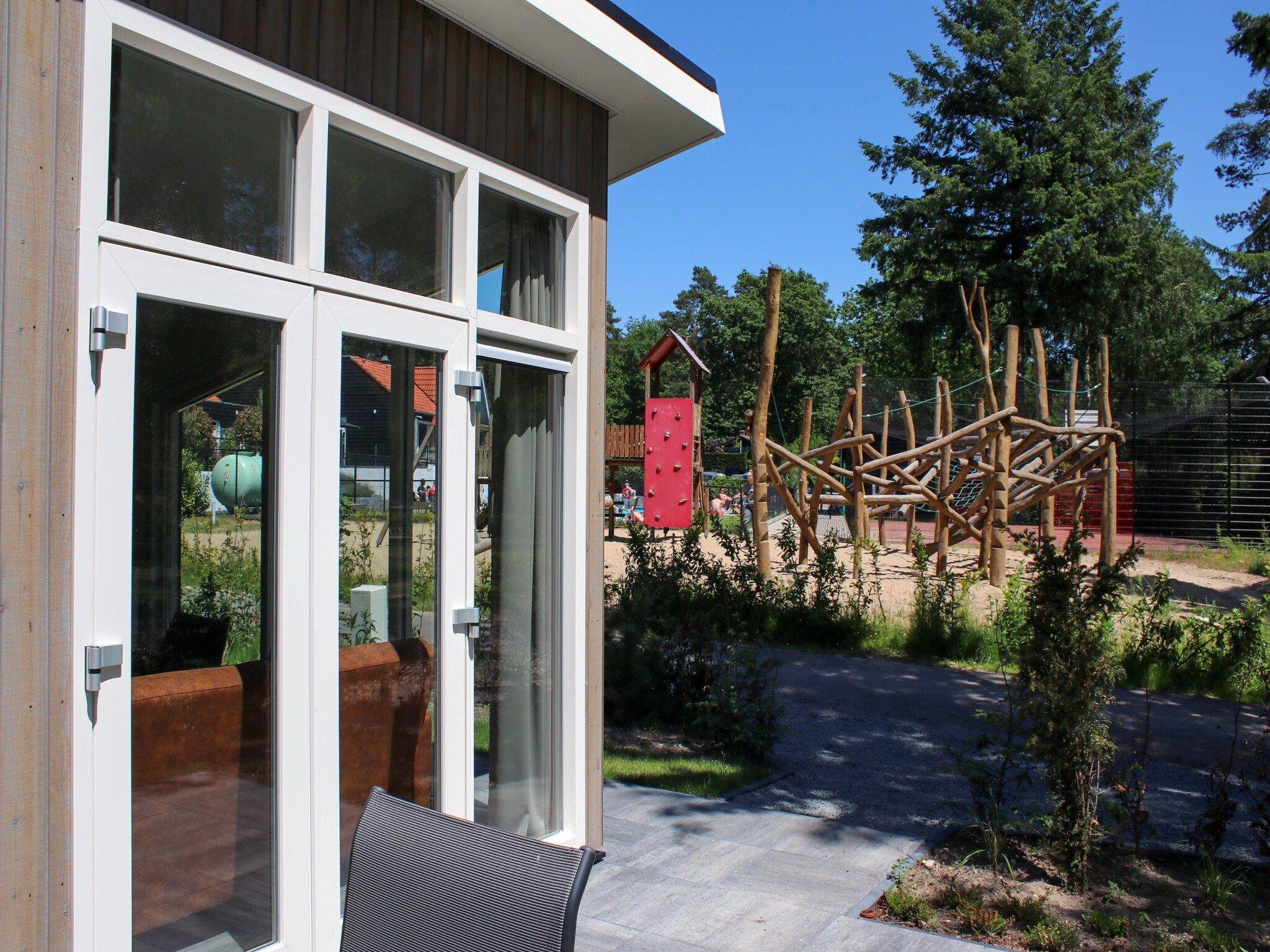 De tuin van Vakantiepark De Rimboe & De Woeste Hoogte 22 in Hoenderloo