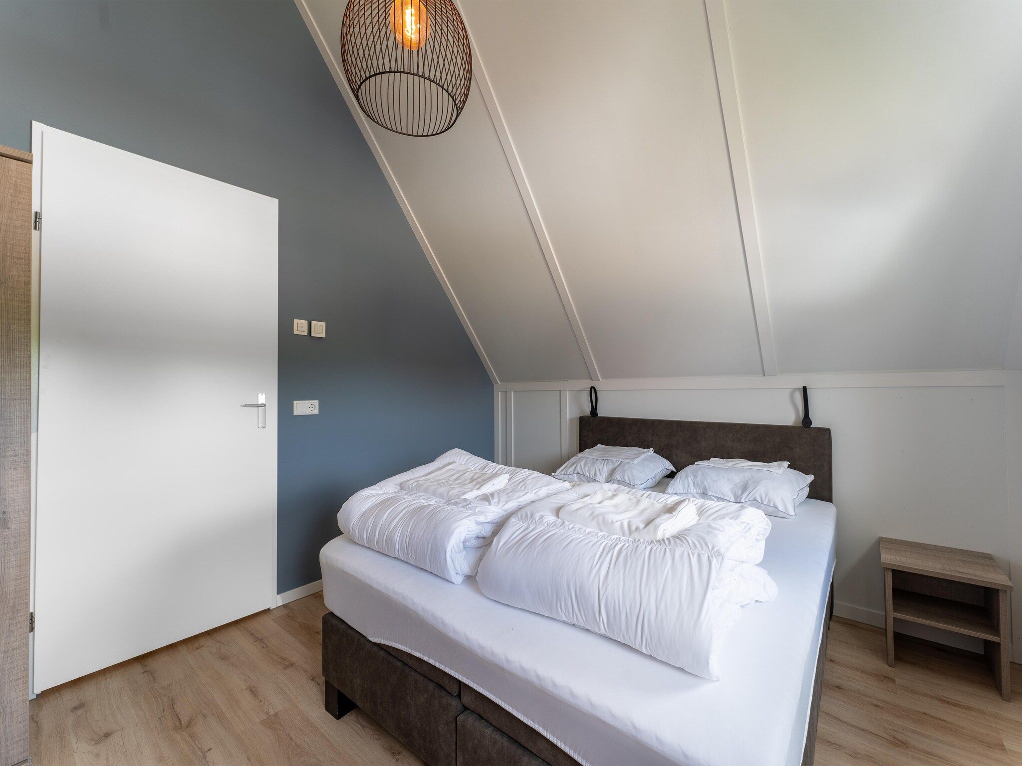 Een slaapkamer van De Scholekster Huis Nr 14 in Scherpenisse