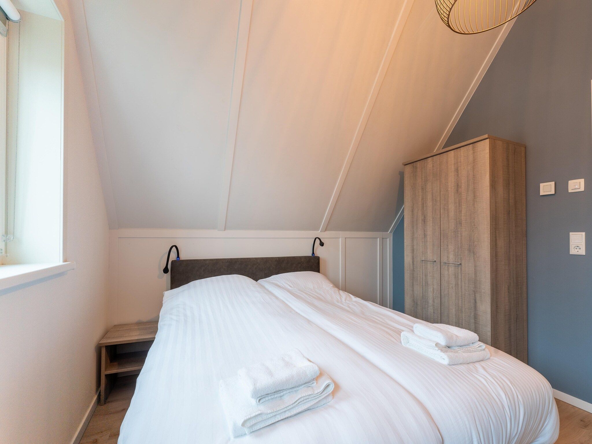 Een slaapkamer van De Wulp Huis Nr 50 in Scherpenisse