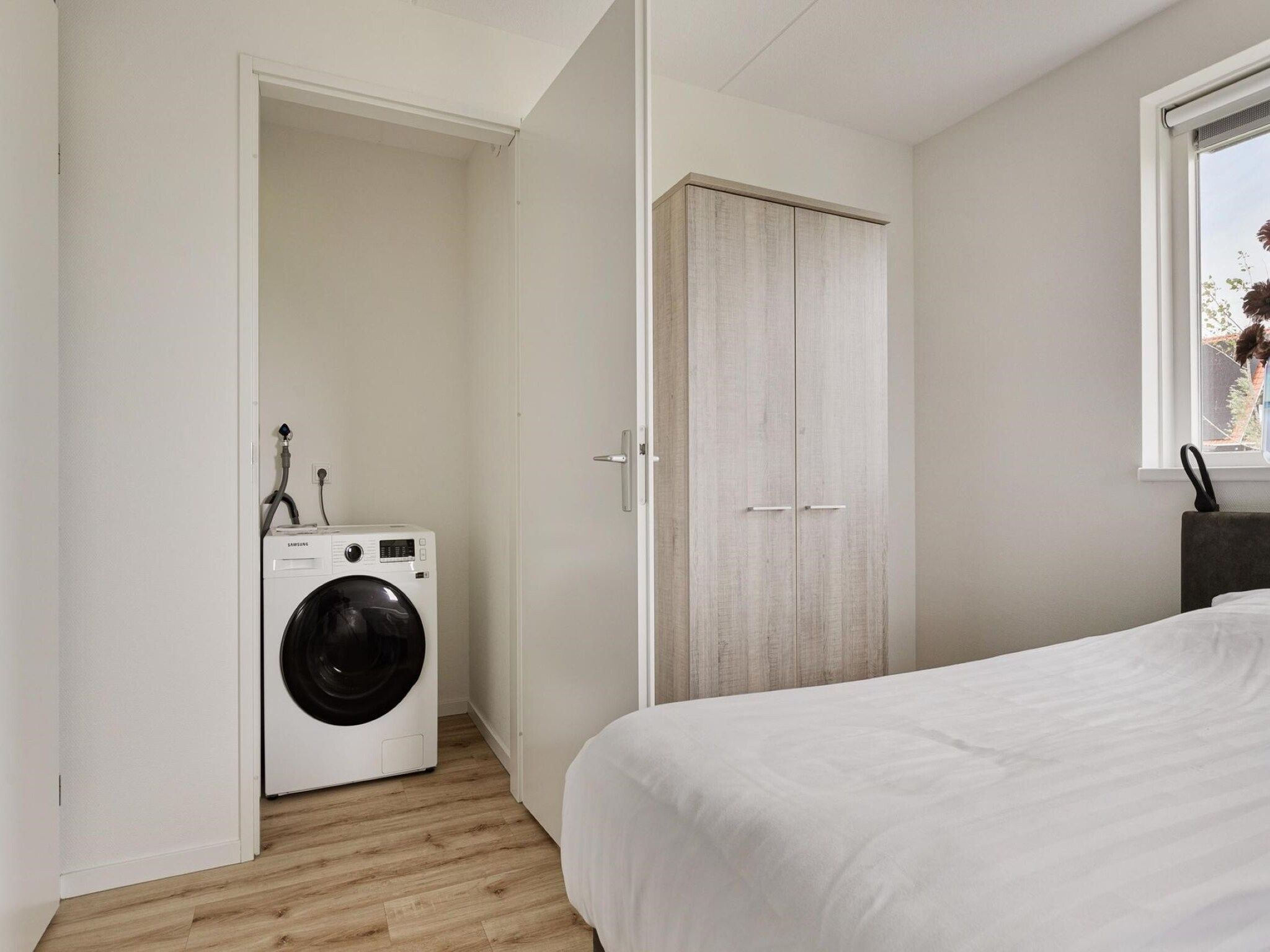 Een slaapkamer van De Ooievaar Huis Nr 47 in Scherpenisse
