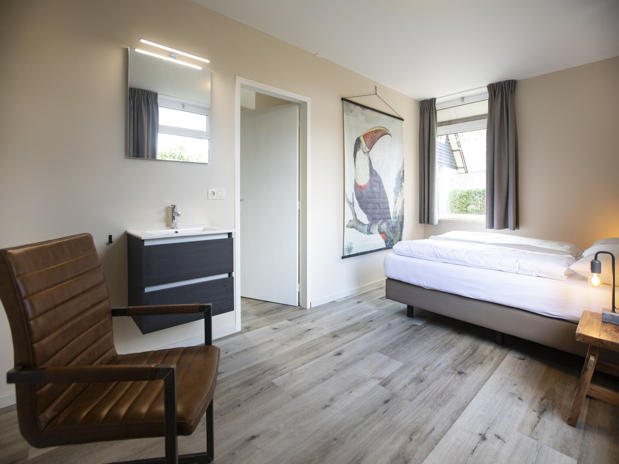 Een slaapkamer van Vakantie bij Meeussen - Schuttersoord 3 in Mook