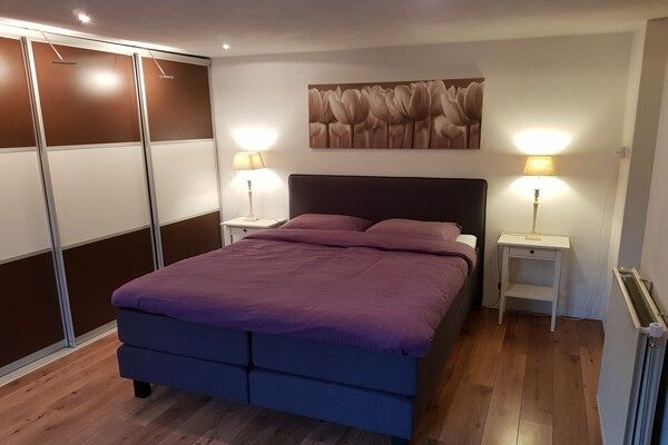 Slaapkamer - Ruim vakantiehuis vlakbij met sauna in Garderen (4)