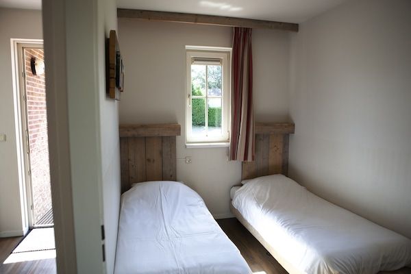 Slaapkamer - Charmante tuinvakantie in Voorthuizen (5)