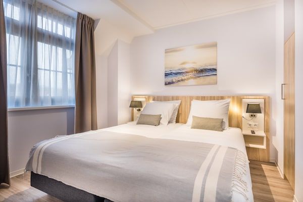 Slaapkamer - Appartement in Zeeland met luxe voorzieningen in Koudekerke (4)