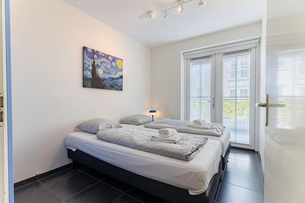 Slaapkamer - Ruim appartement op 250 m van het strand in Koudekerke (4)