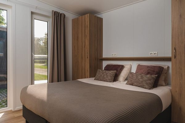 Slaapkamer - Prachtige lodge aan de rivier met panoramisch uitzicht in Zuna (2)